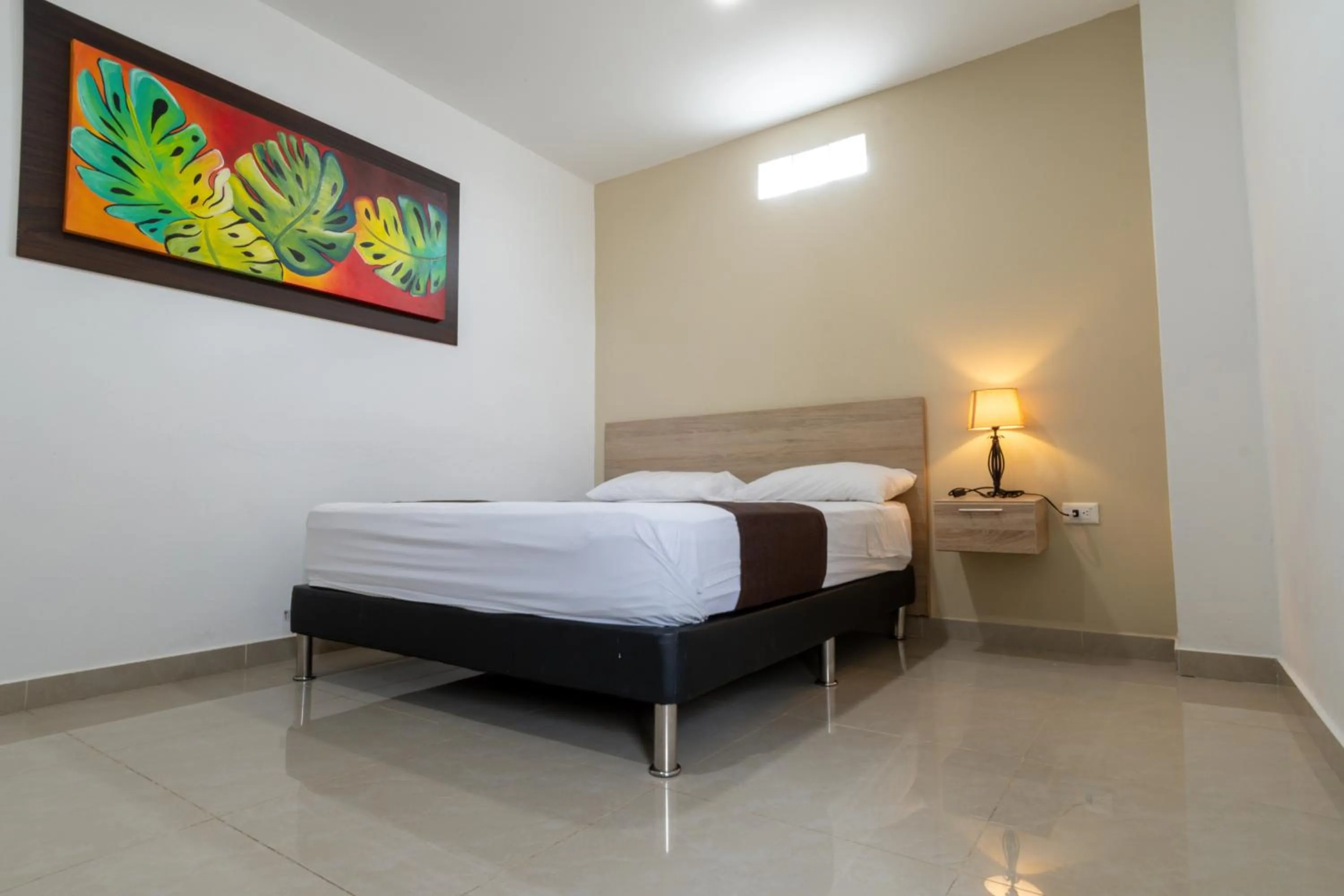 Bed in Genesis Hotel