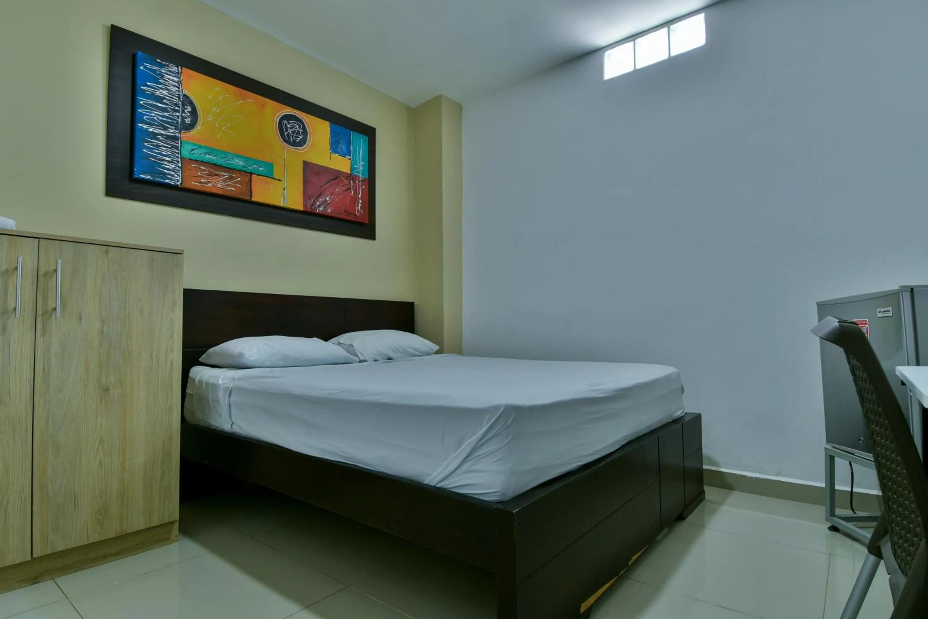 Bed in Genesis Hotel