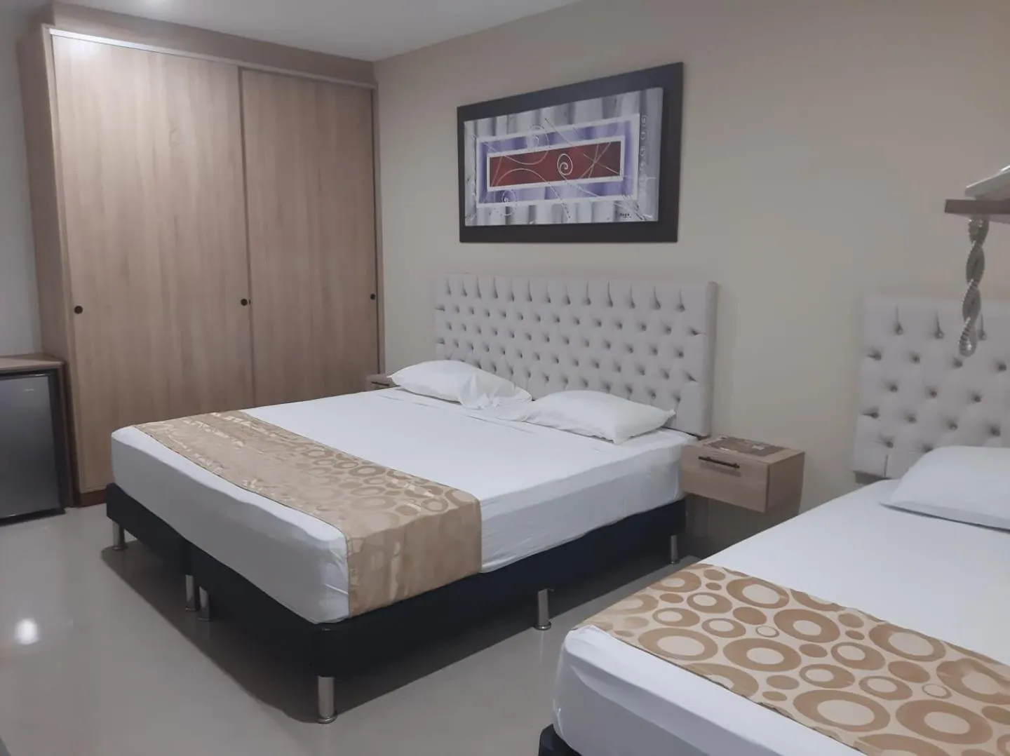 Bed in Genesis Hotel