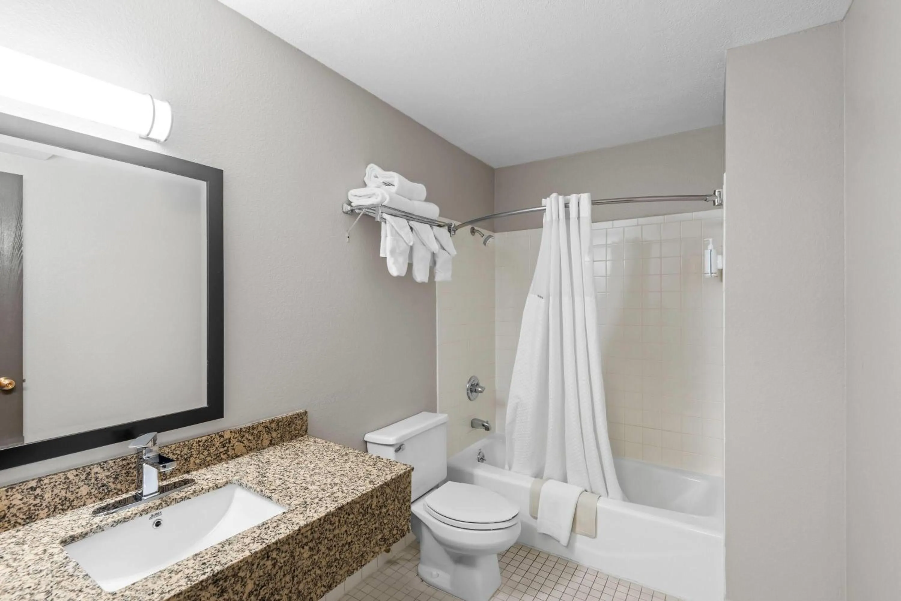 Bathroom in Days Inn & Suites by Wyndham Des Moines Airport