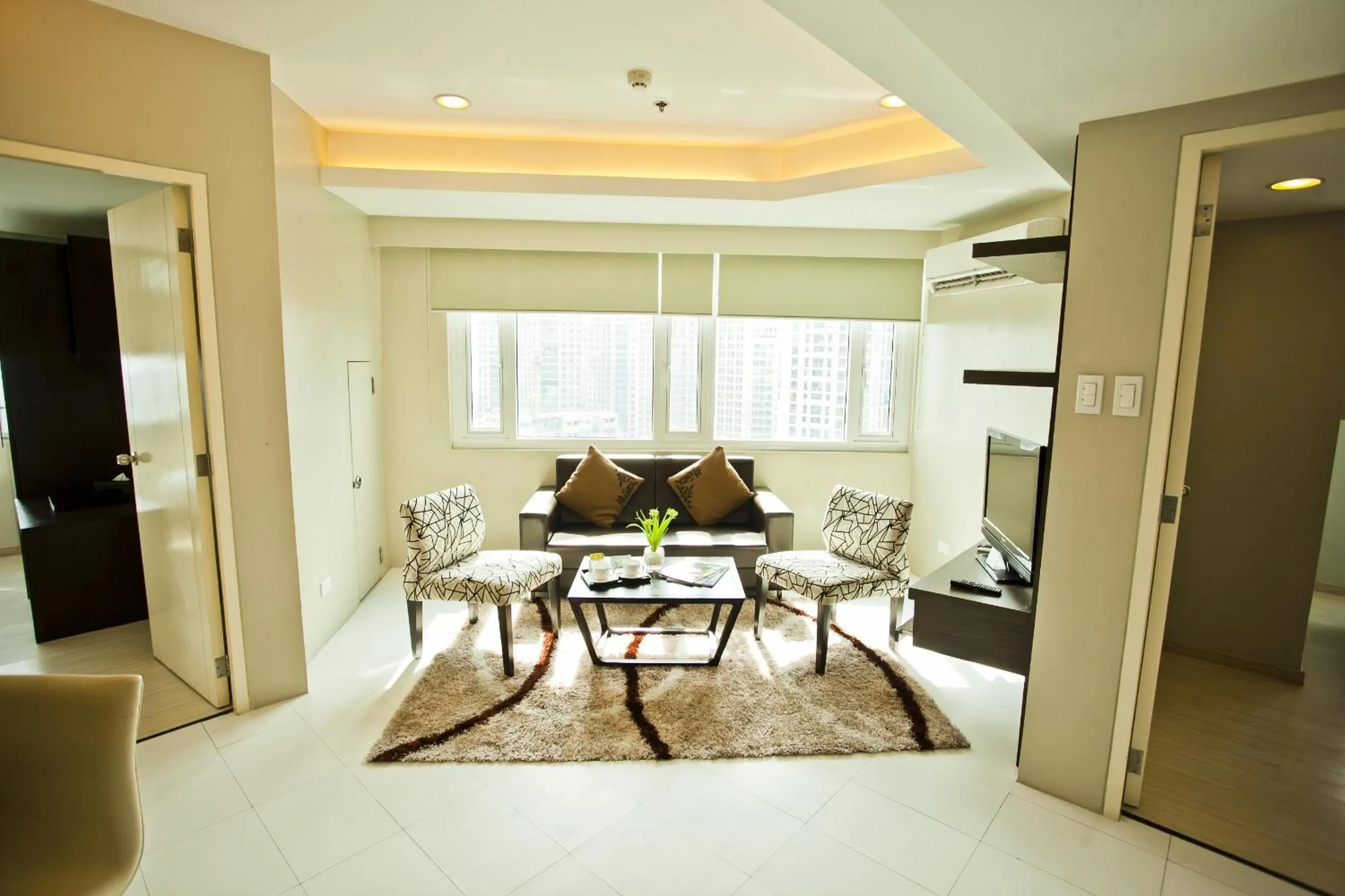 Living room in The Exchange Regency Residence Hotel Managed by HII