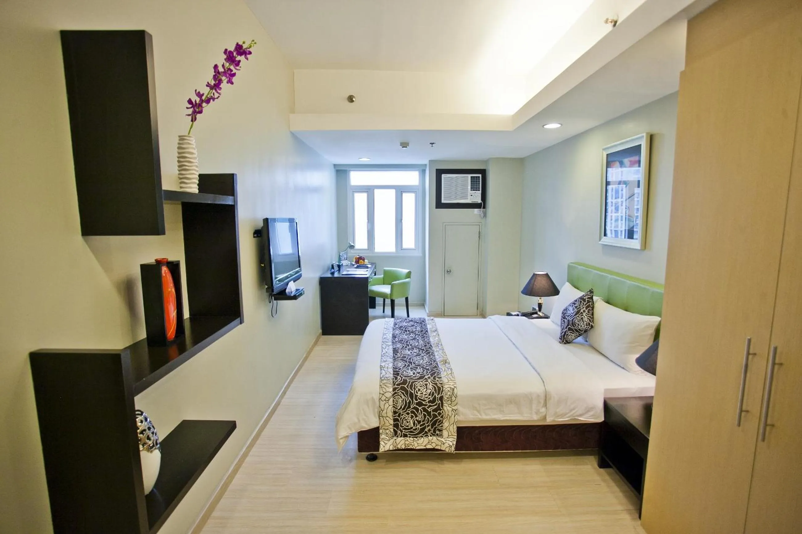 Bed in The Exchange Regency Residence Hotel Managed by HII