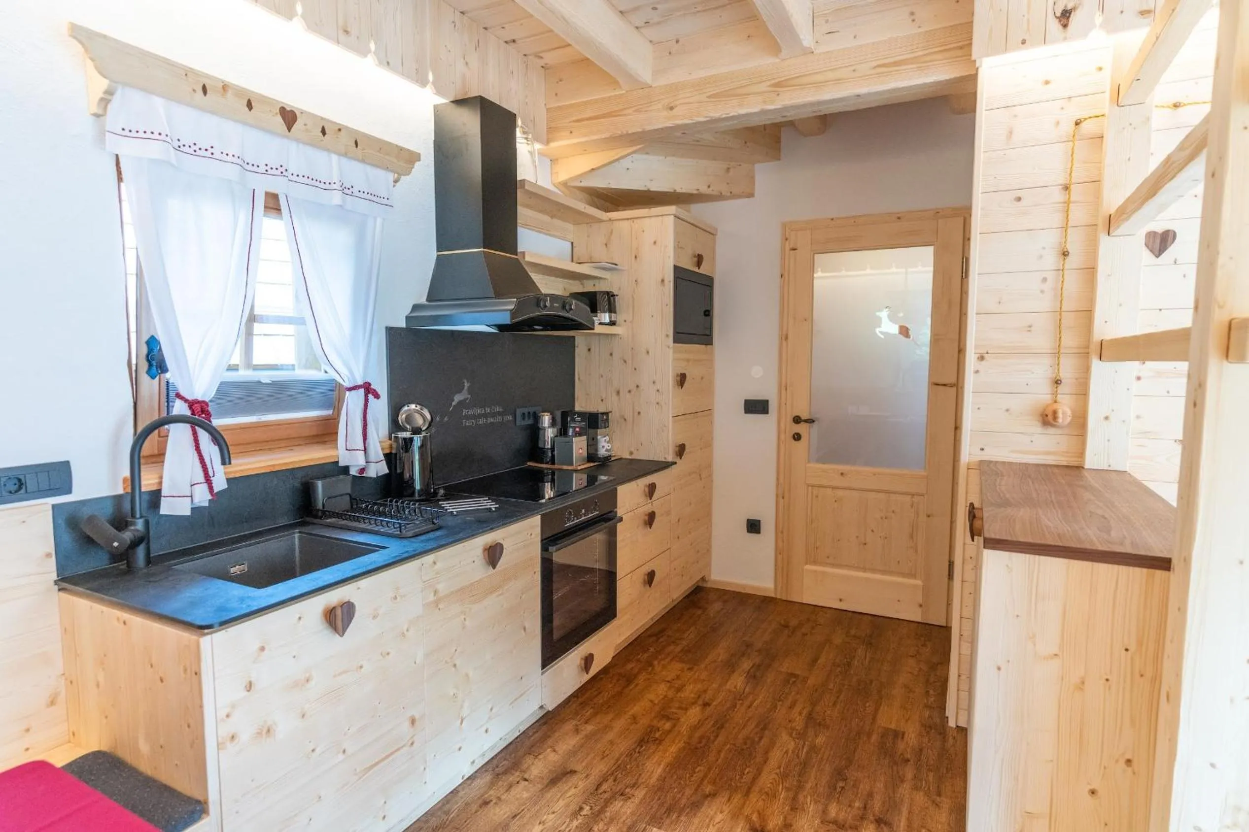 Kitchen or kitchenette in ALPIK Chalets - Bohinj