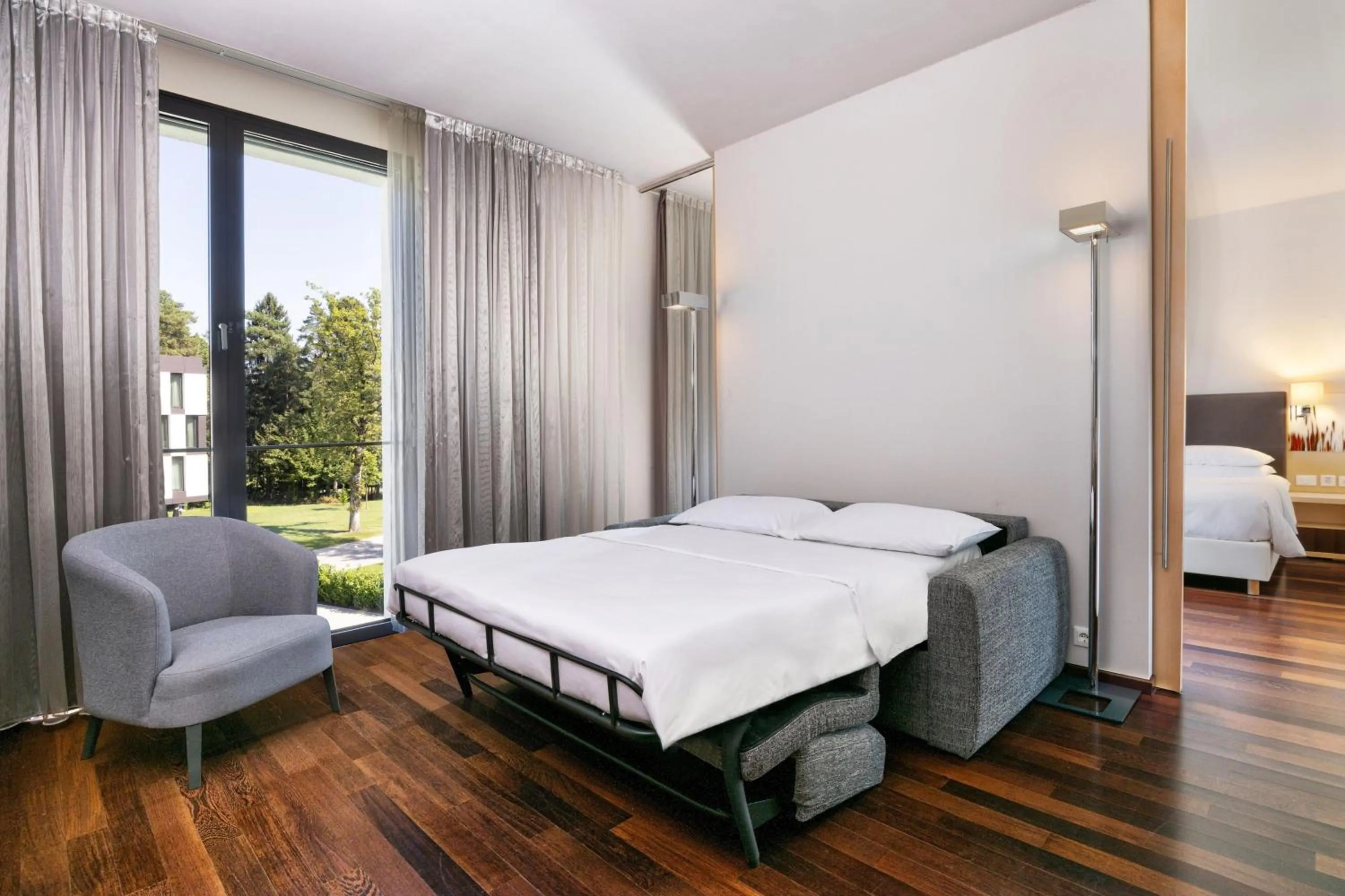 Photo of the whole room, Bed in Four Points by Sheraton Ljubljana Mons