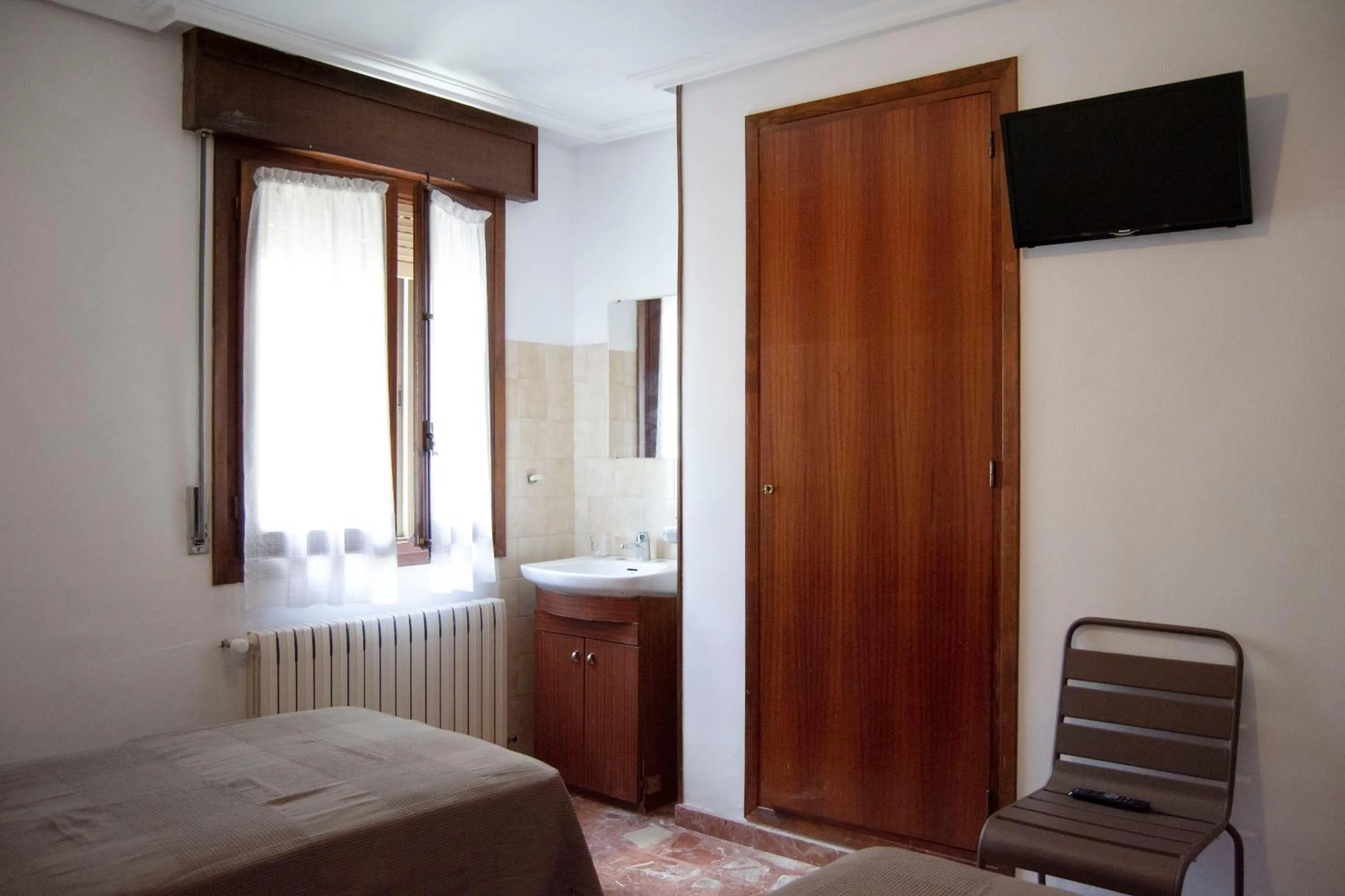 Photo of the whole room, Bed in Tres Puentes Anguiano Apartamentos y Hostal