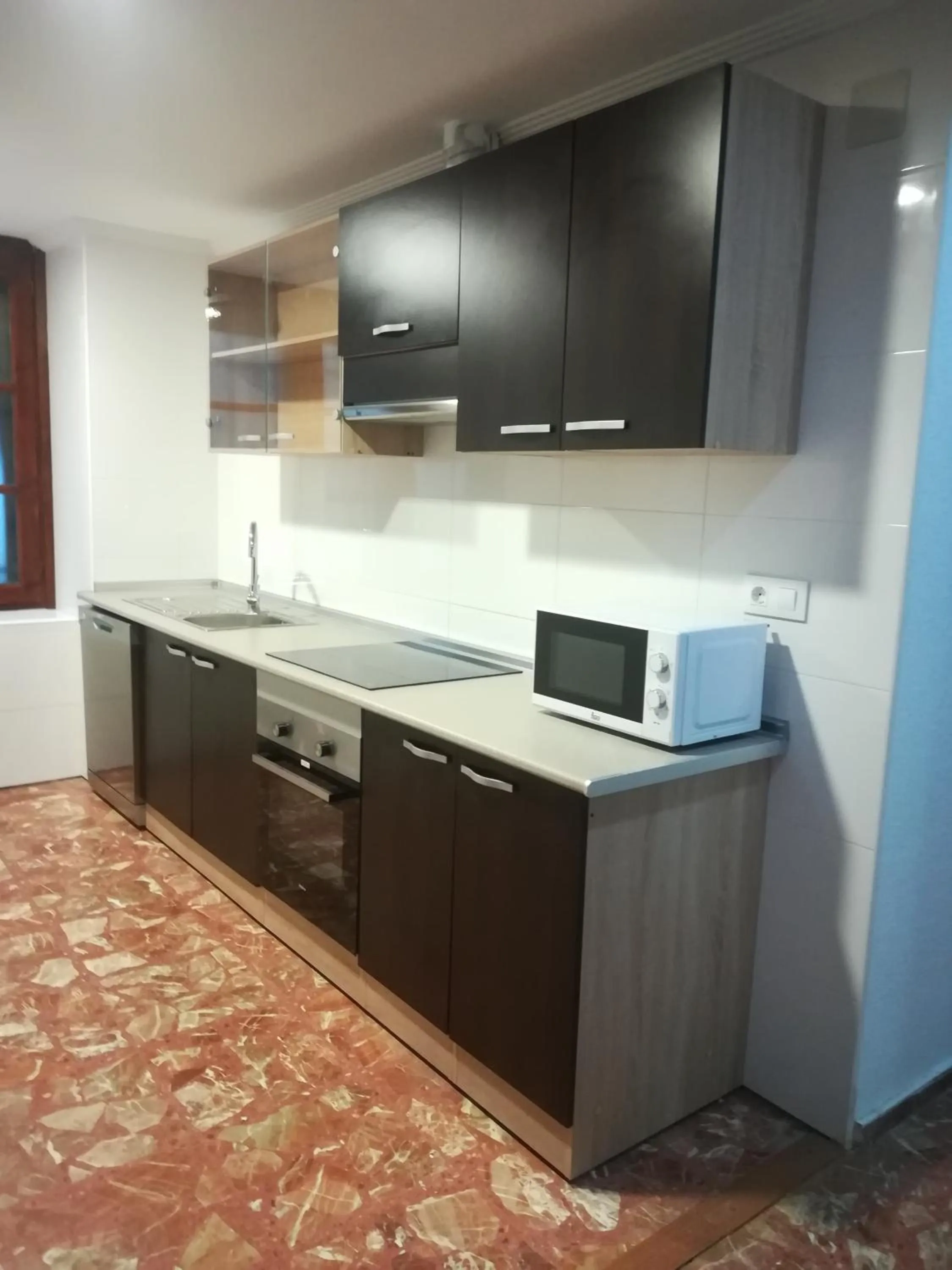 Kitchen or kitchenette in Tres Puentes Anguiano Apartamentos y Hostal