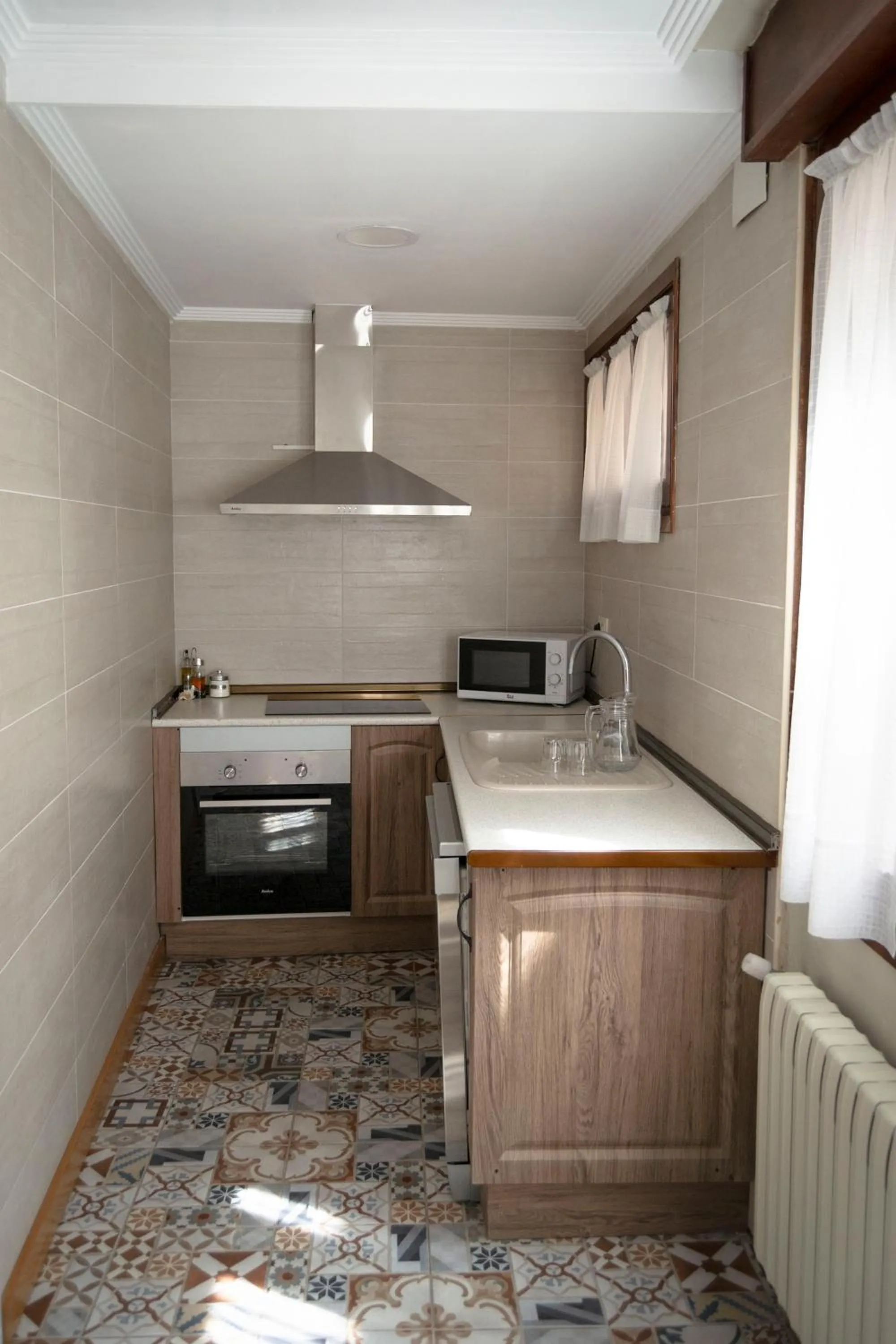 Kitchen or kitchenette in Tres Puentes Anguiano Apartamentos y Hostal