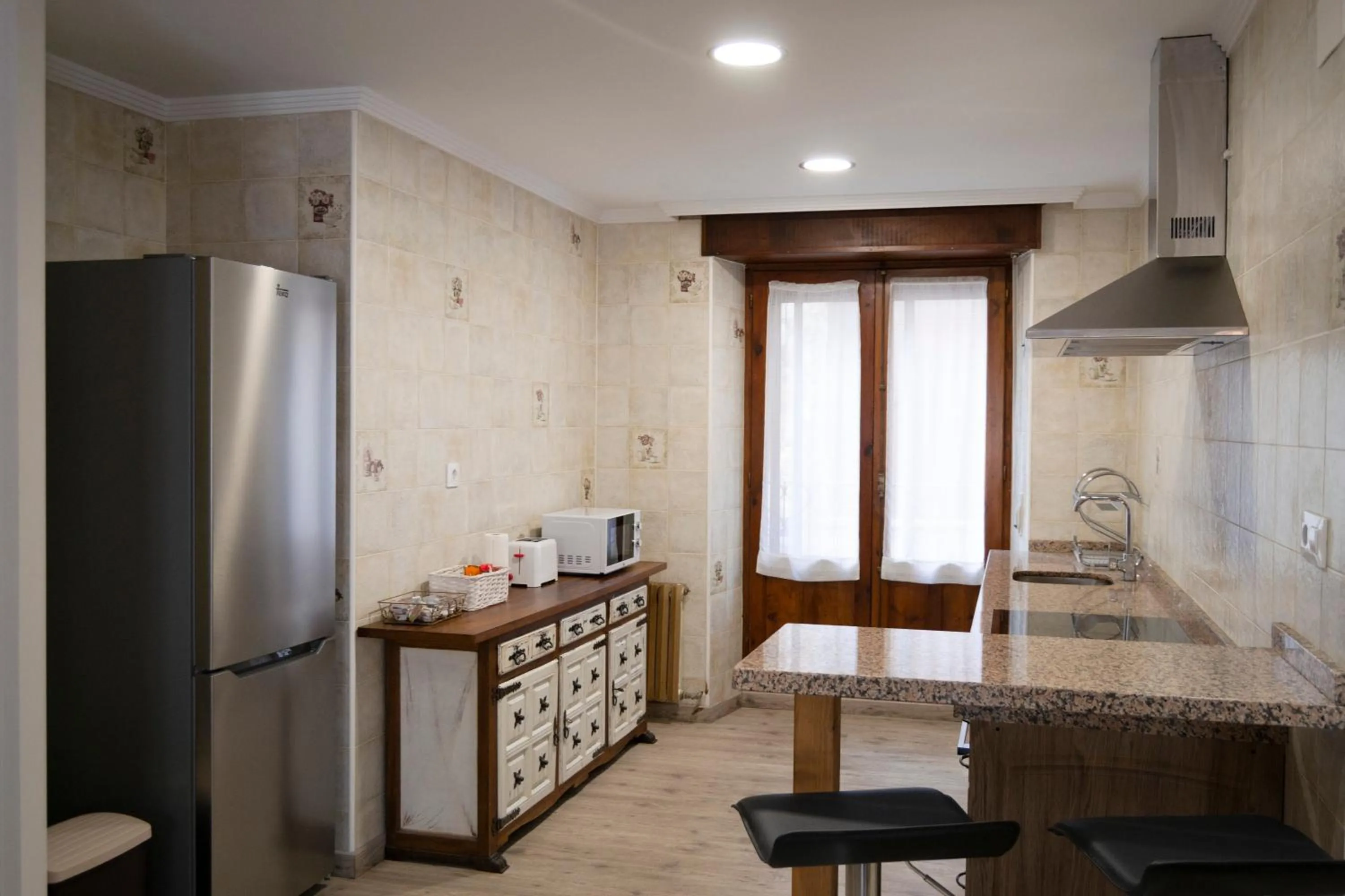 Kitchen or kitchenette in Tres Puentes Anguiano Apartamentos y Hostal