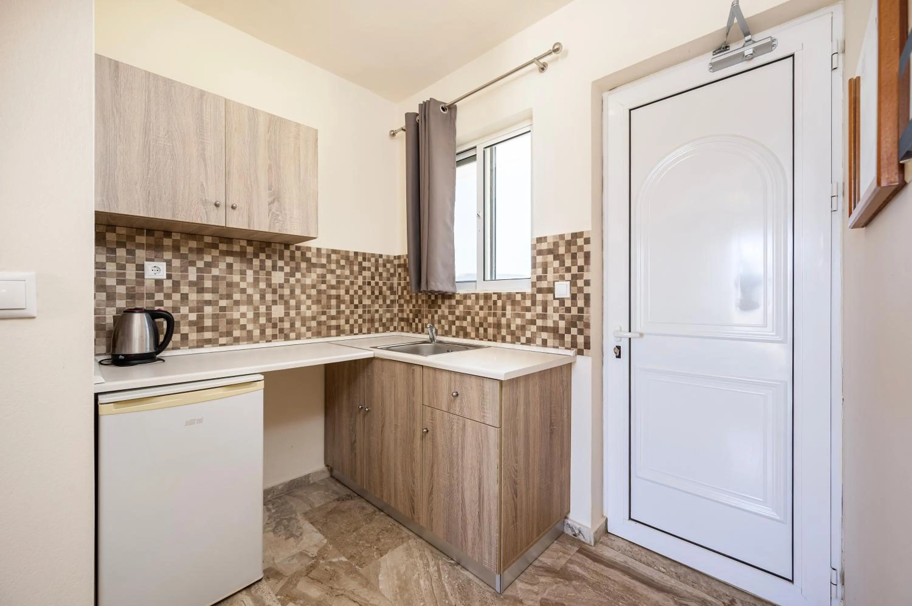 Kitchen or kitchenette in Mammis Beach Hotel