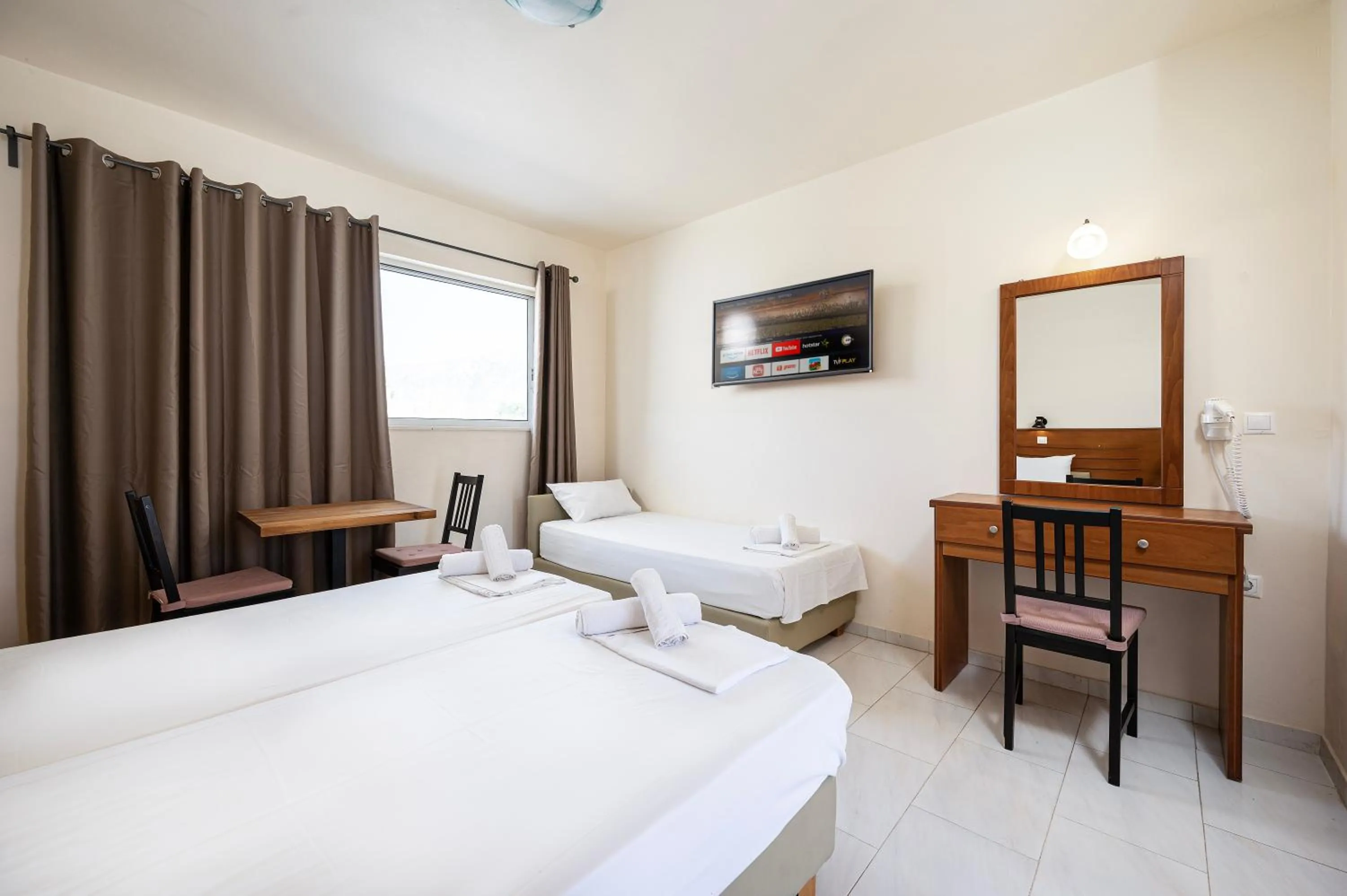 Bed in Mammis Beach Hotel