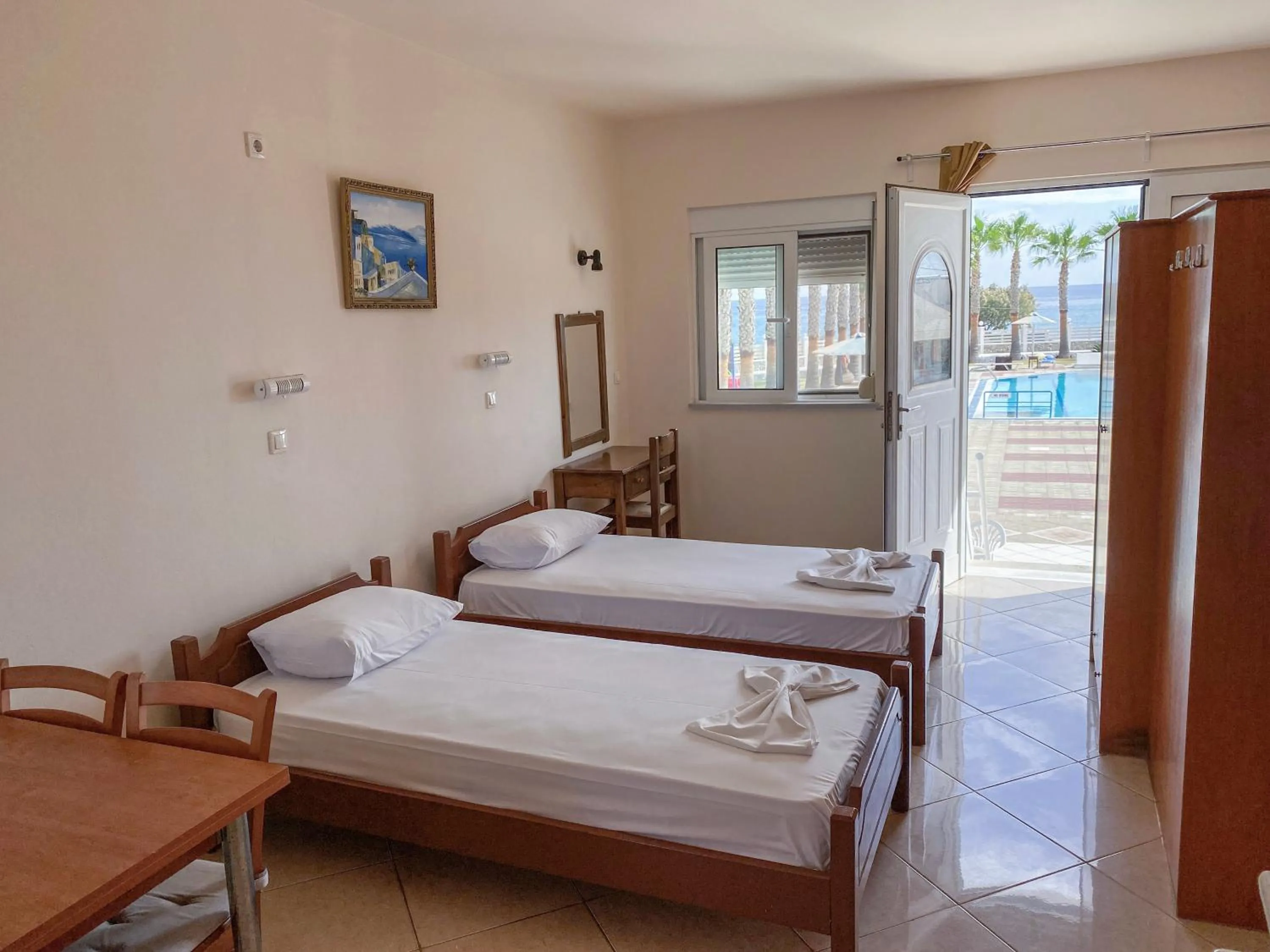 Bed in Mammis Beach Hotel