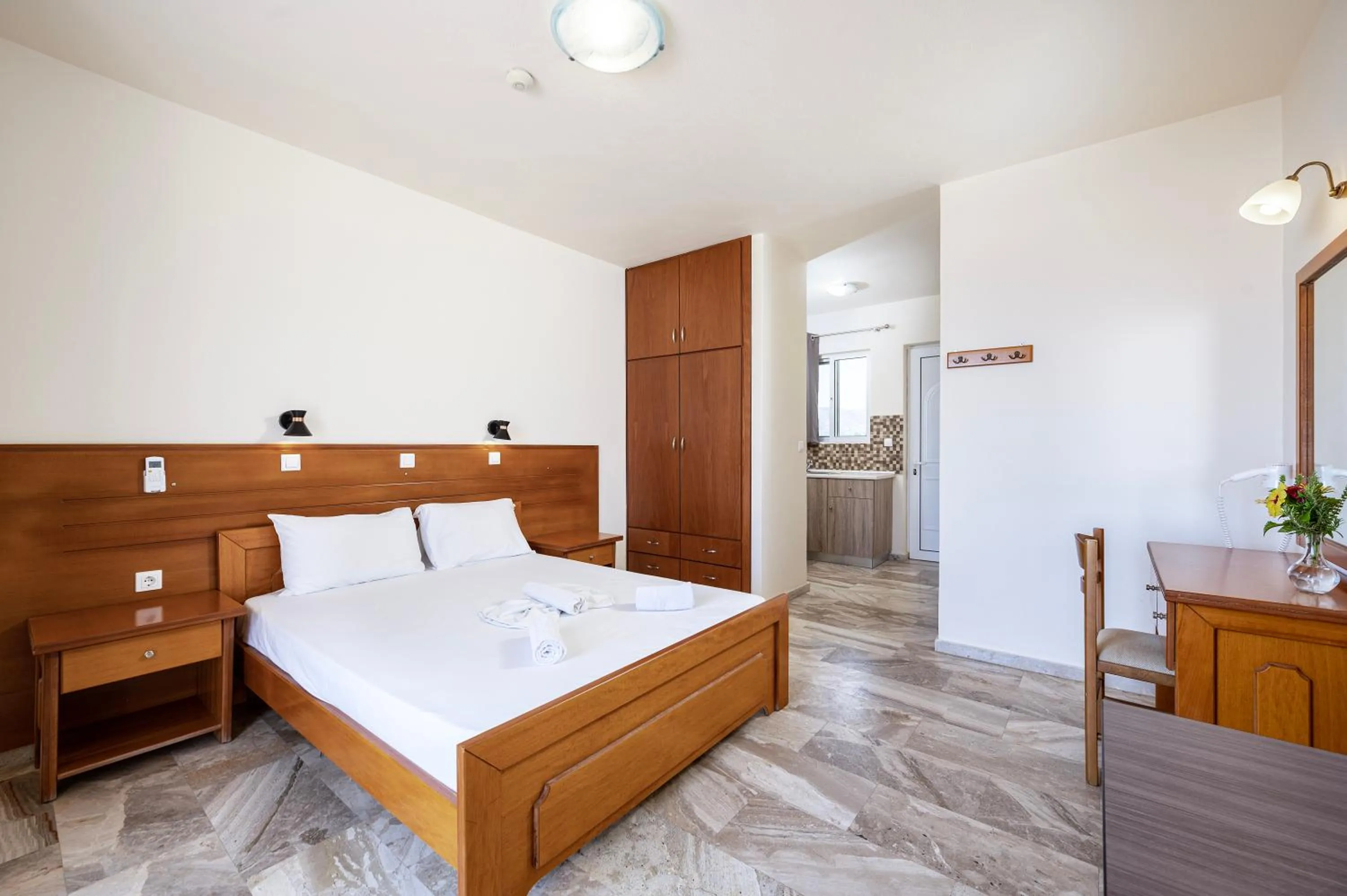 Bed in Mammis Beach Hotel