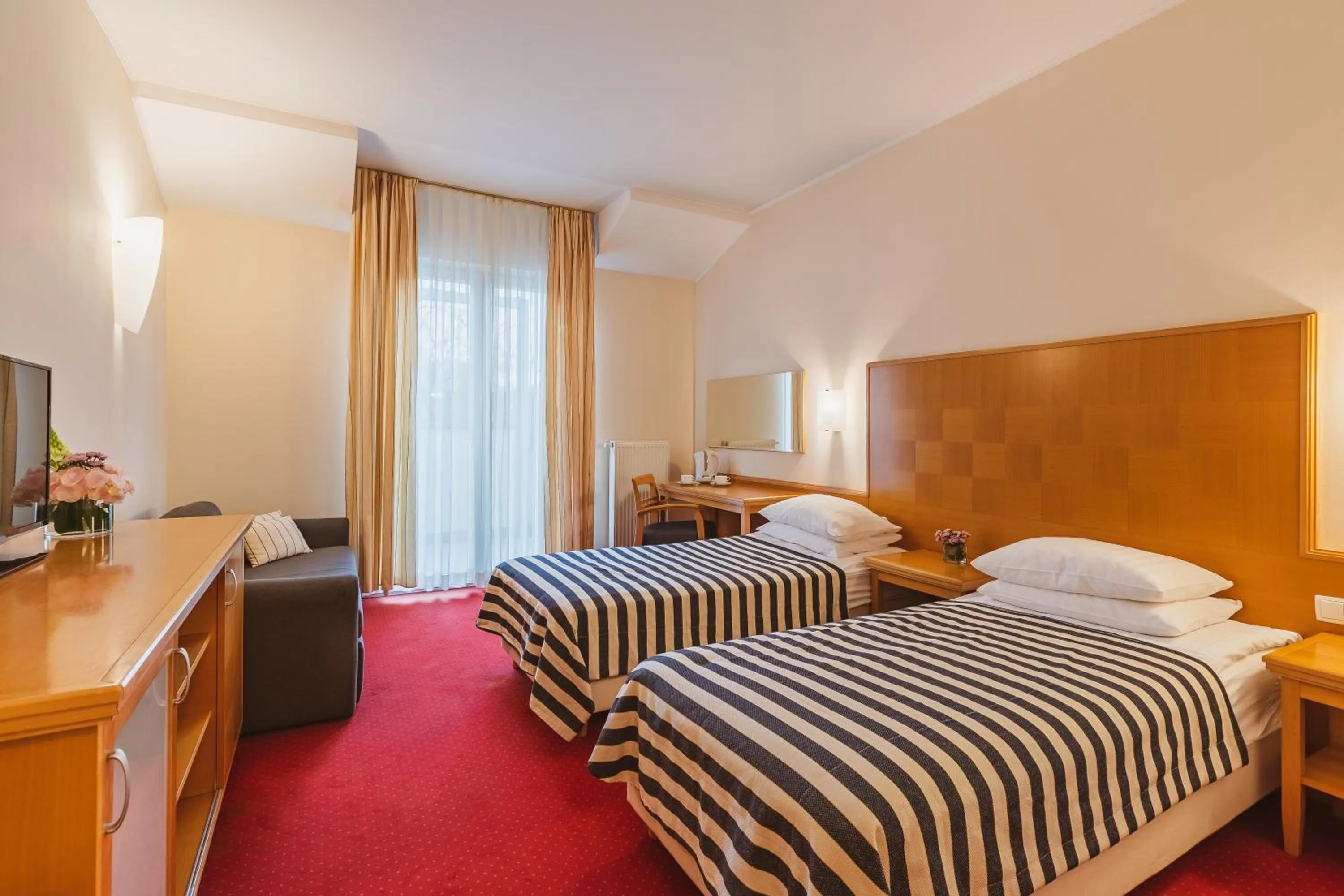 Photo of the whole room, Bed in Ramada Hotel & Suites Kranjska Gora