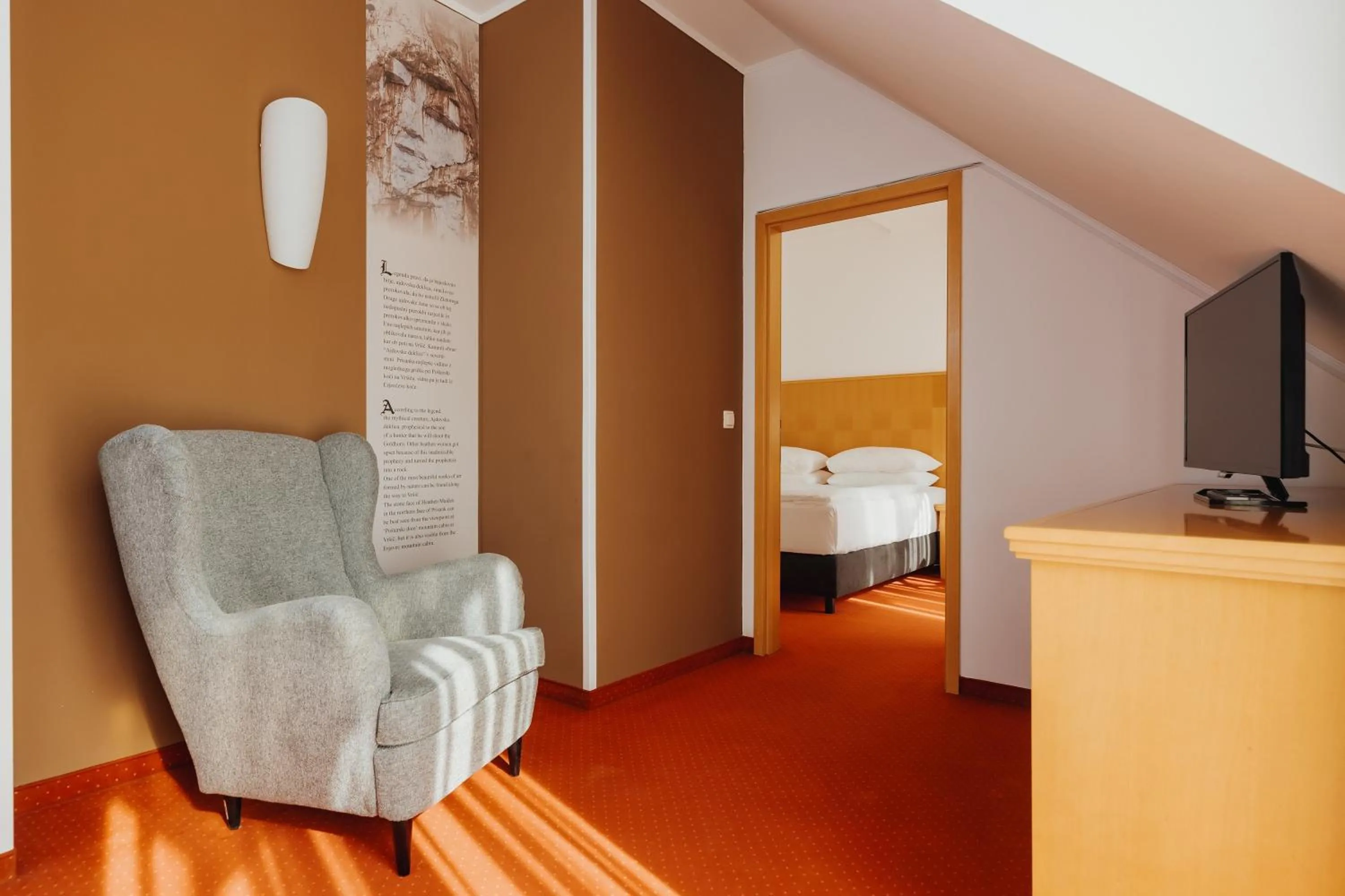 Living room, Bed in Ramada Hotel & Suites Kranjska Gora