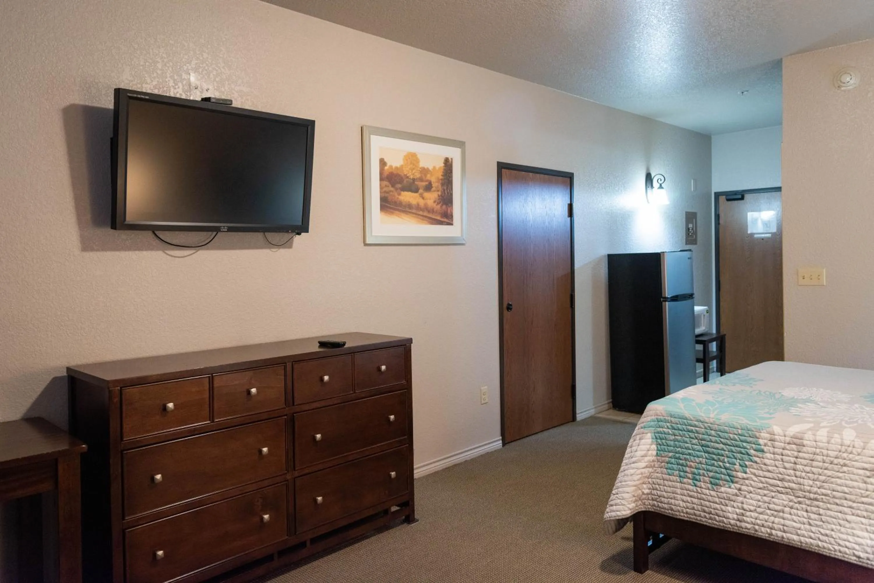 Bed in Premium Inn and Suites