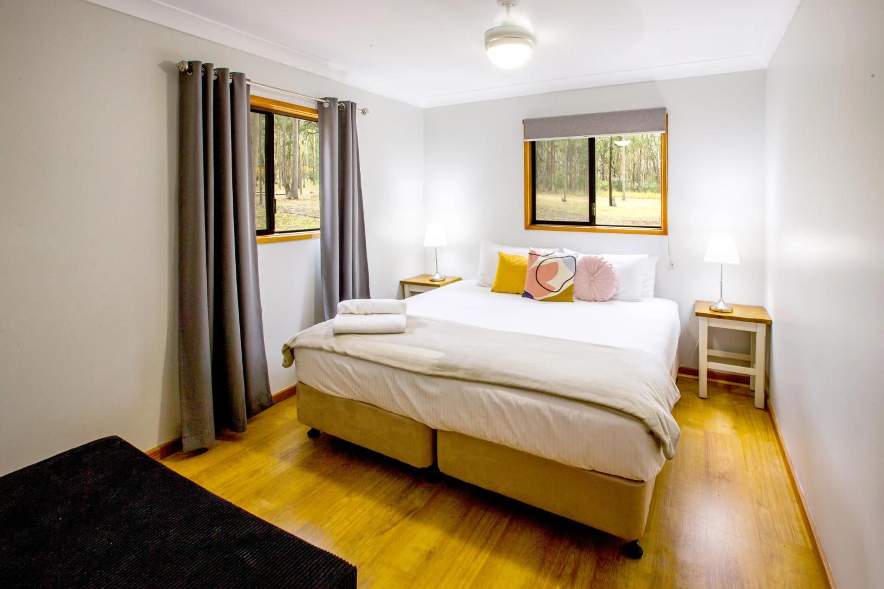 Bed in Pokolbin Cottages