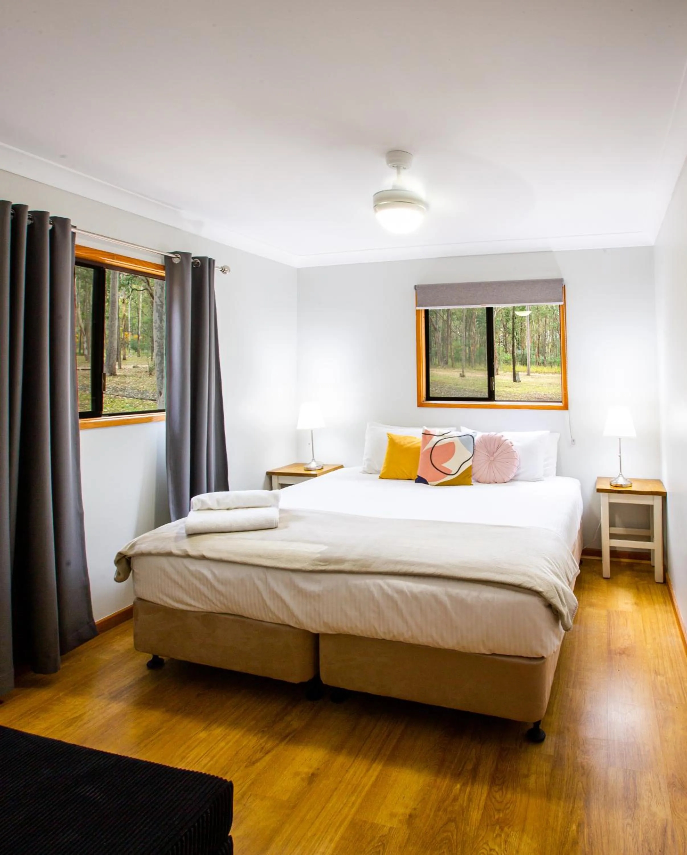 Bed in Pokolbin Cottages