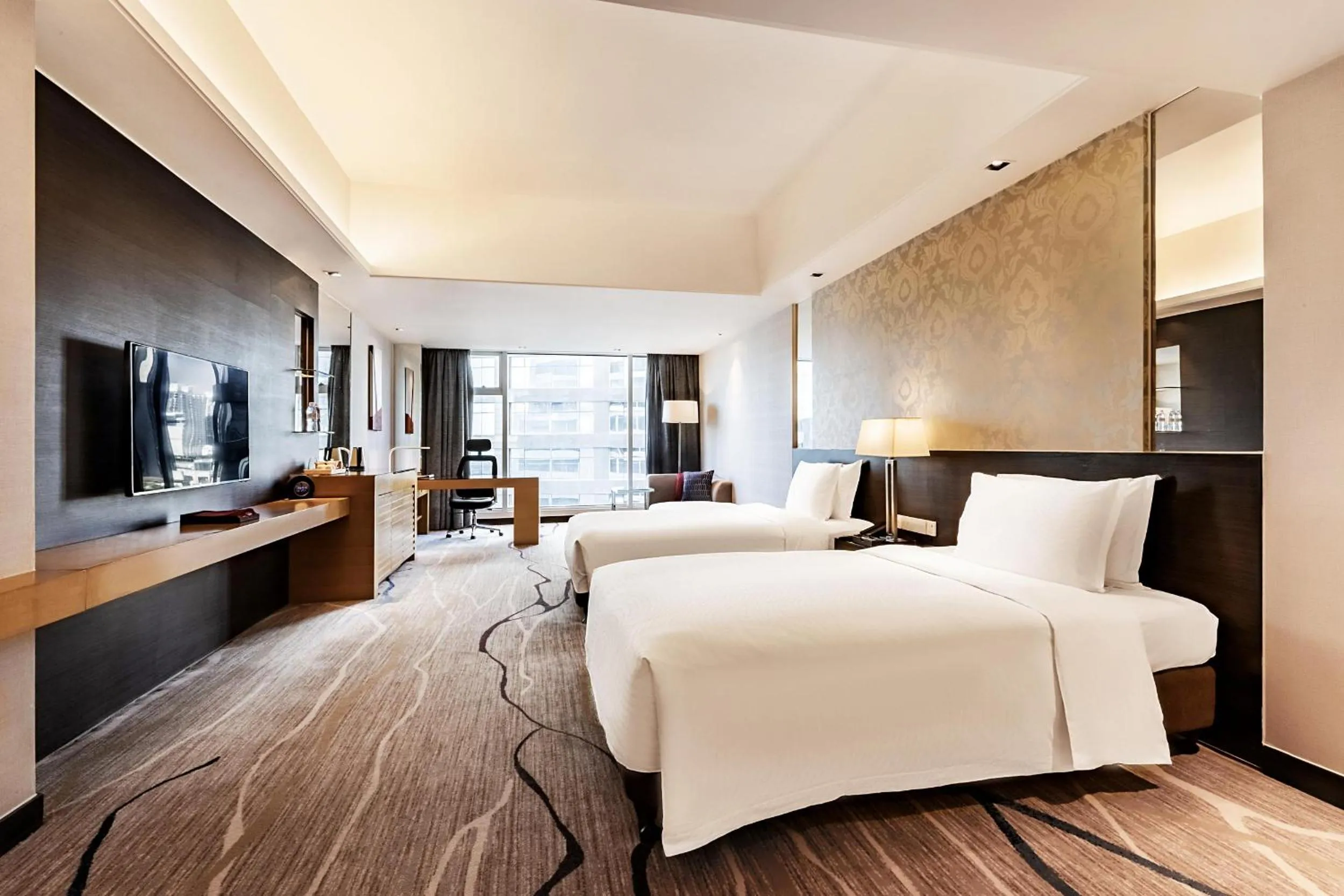 Communal lounge/ TV room, Bed in Swiss Grand Xiamen