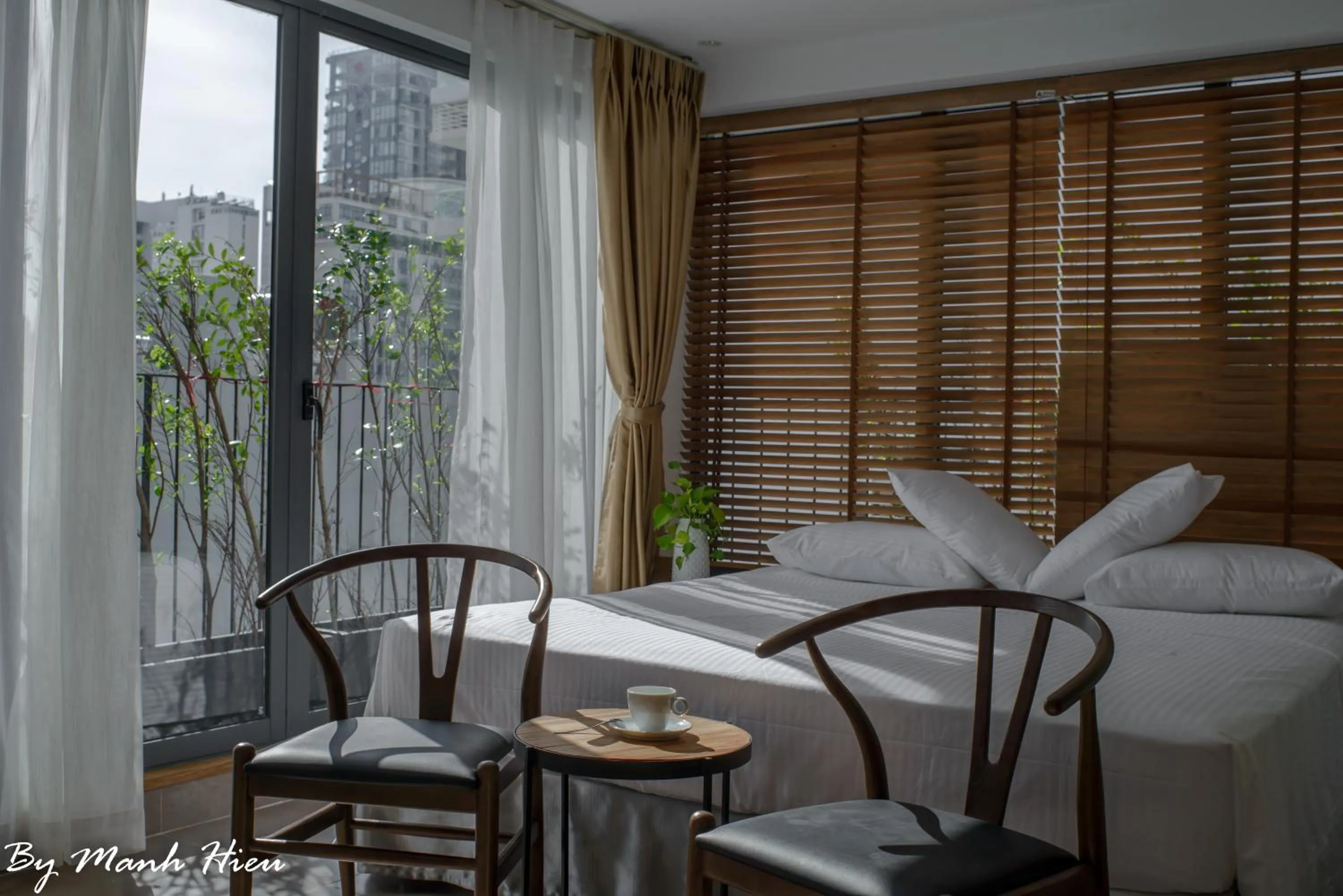 Bed in Mojzo Inn Boutique Hotel