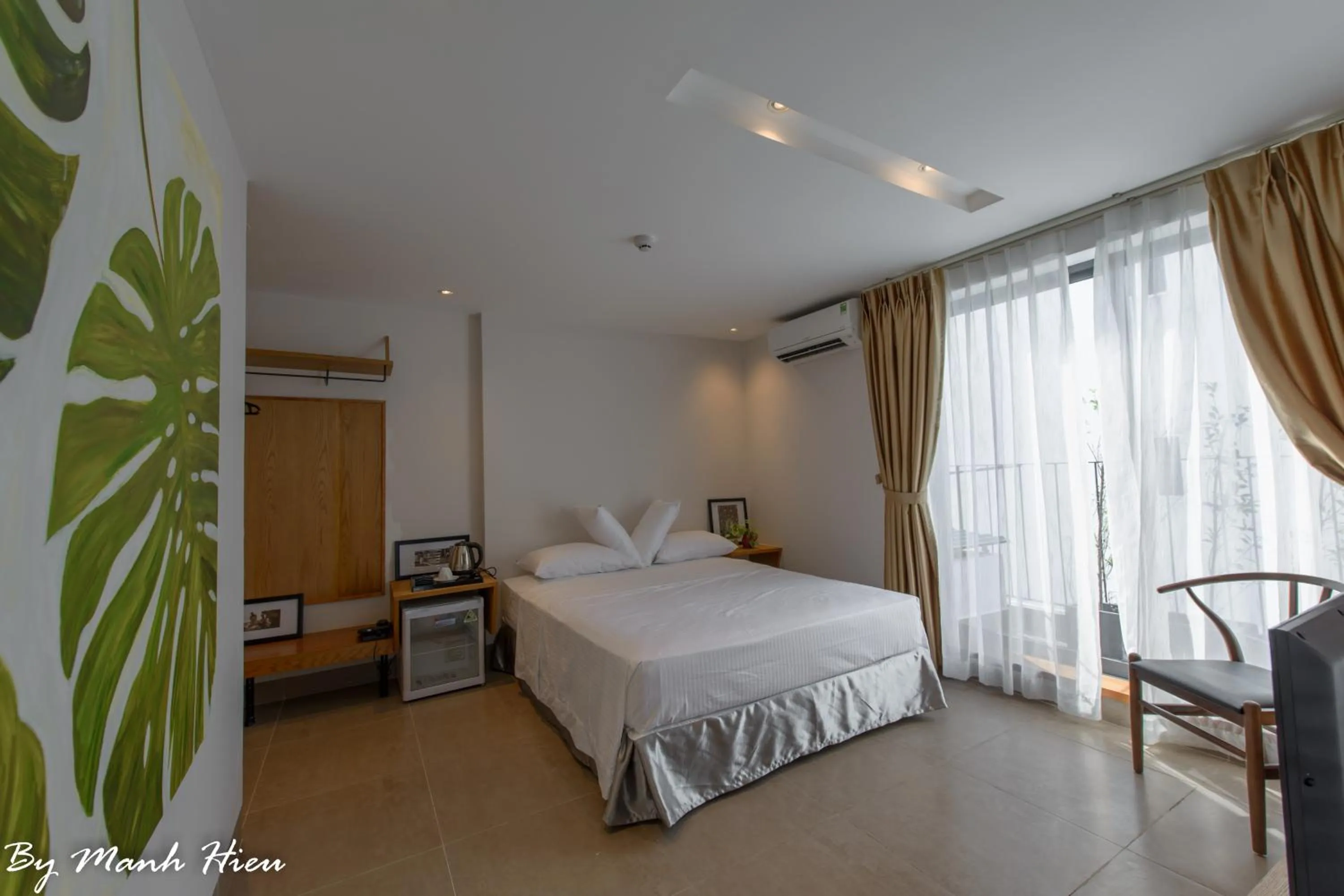 Bed in Mojzo Inn Boutique Hotel