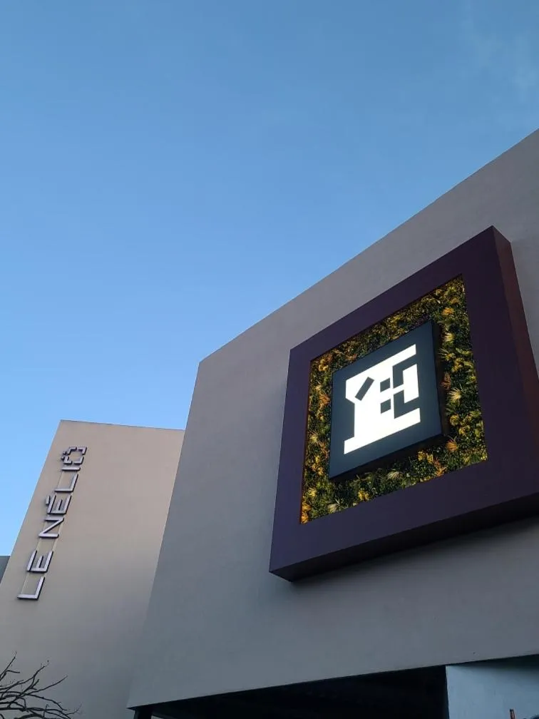 Property logo or sign in Le Néliö