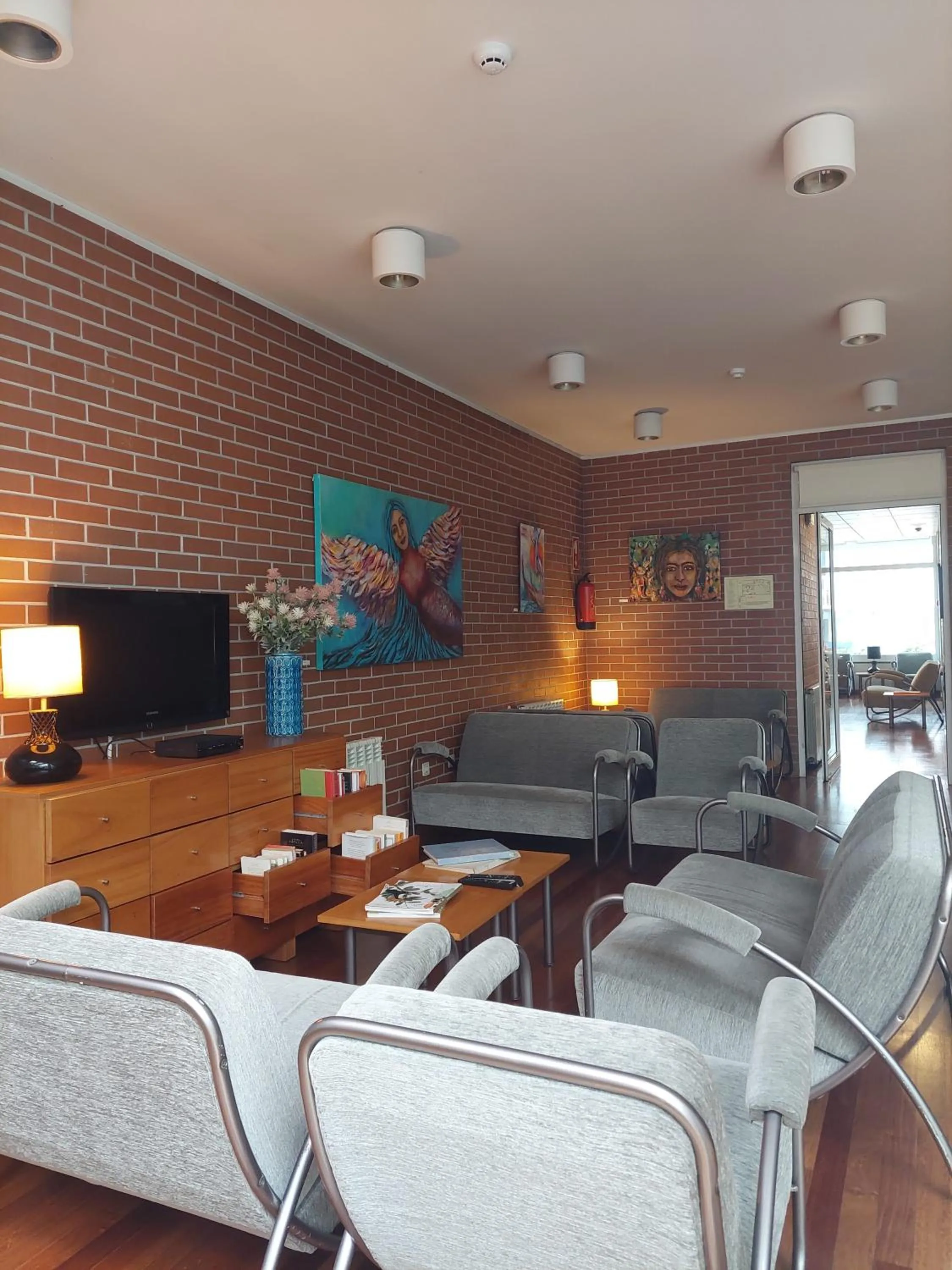 Communal lounge/ TV room in Costa Nova Hotel