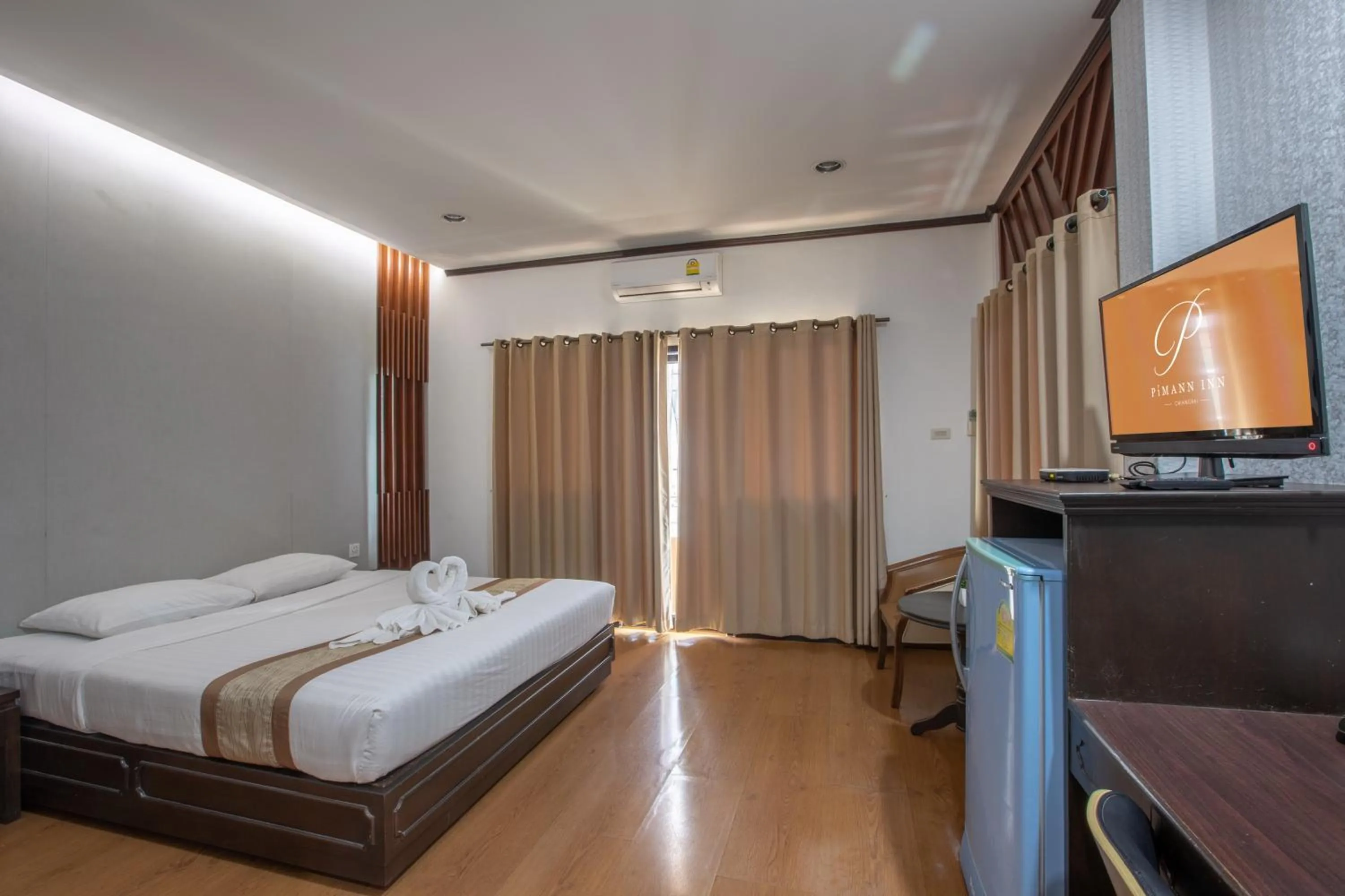 Bed in Pimann Inn Hotel