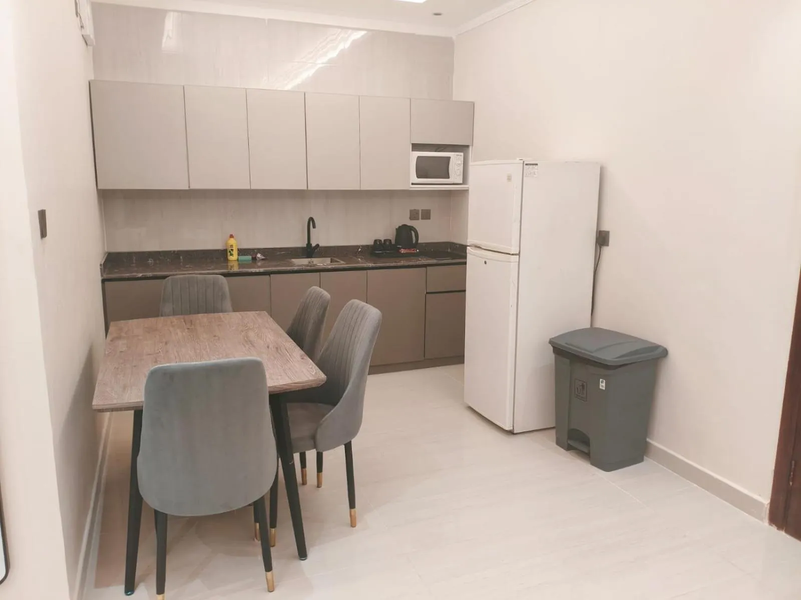 Kitchen or kitchenette in Burj Al Hayat Furnished Suites - Al Malaz