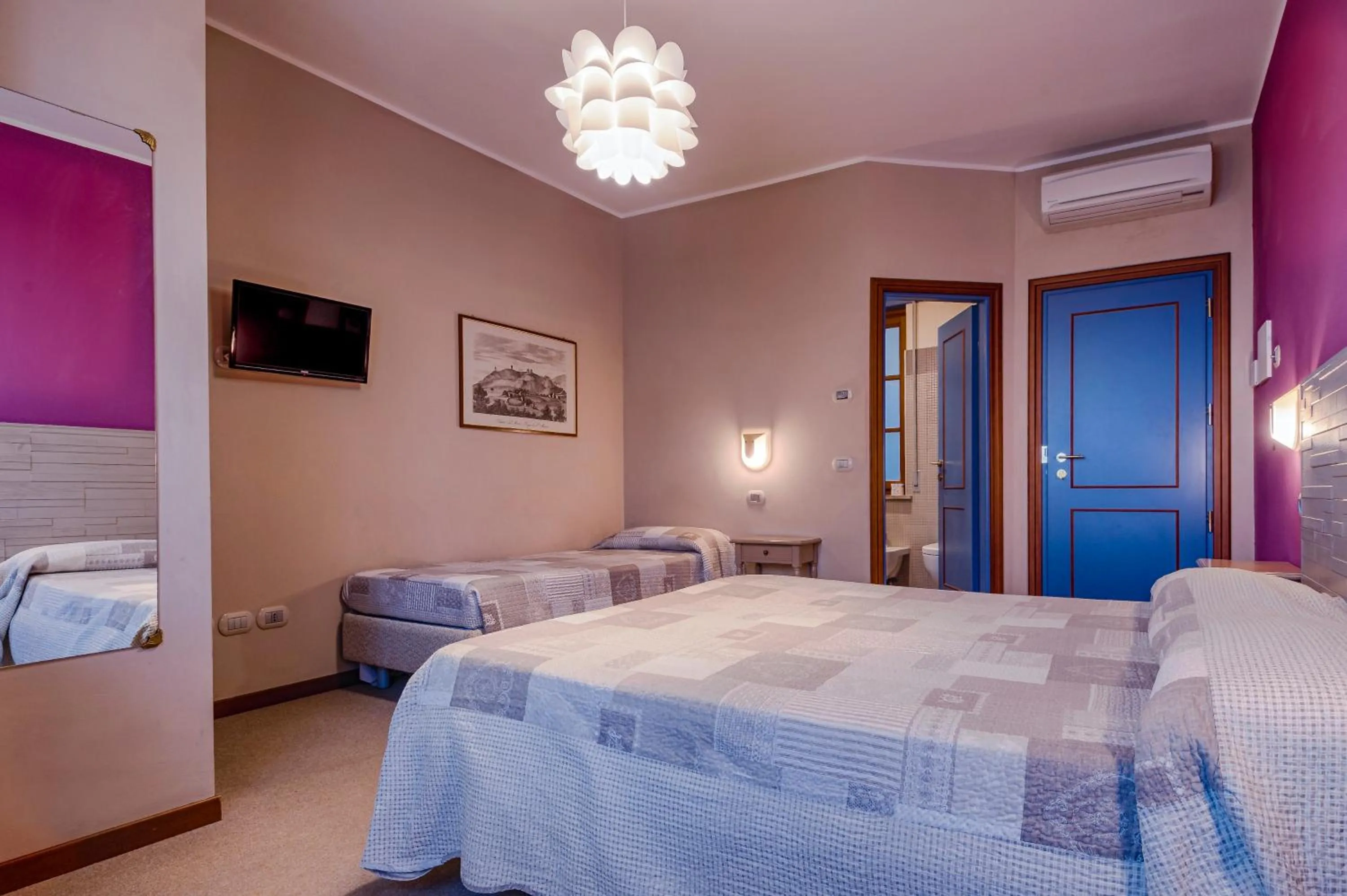 Bed in La Grotta Hotel