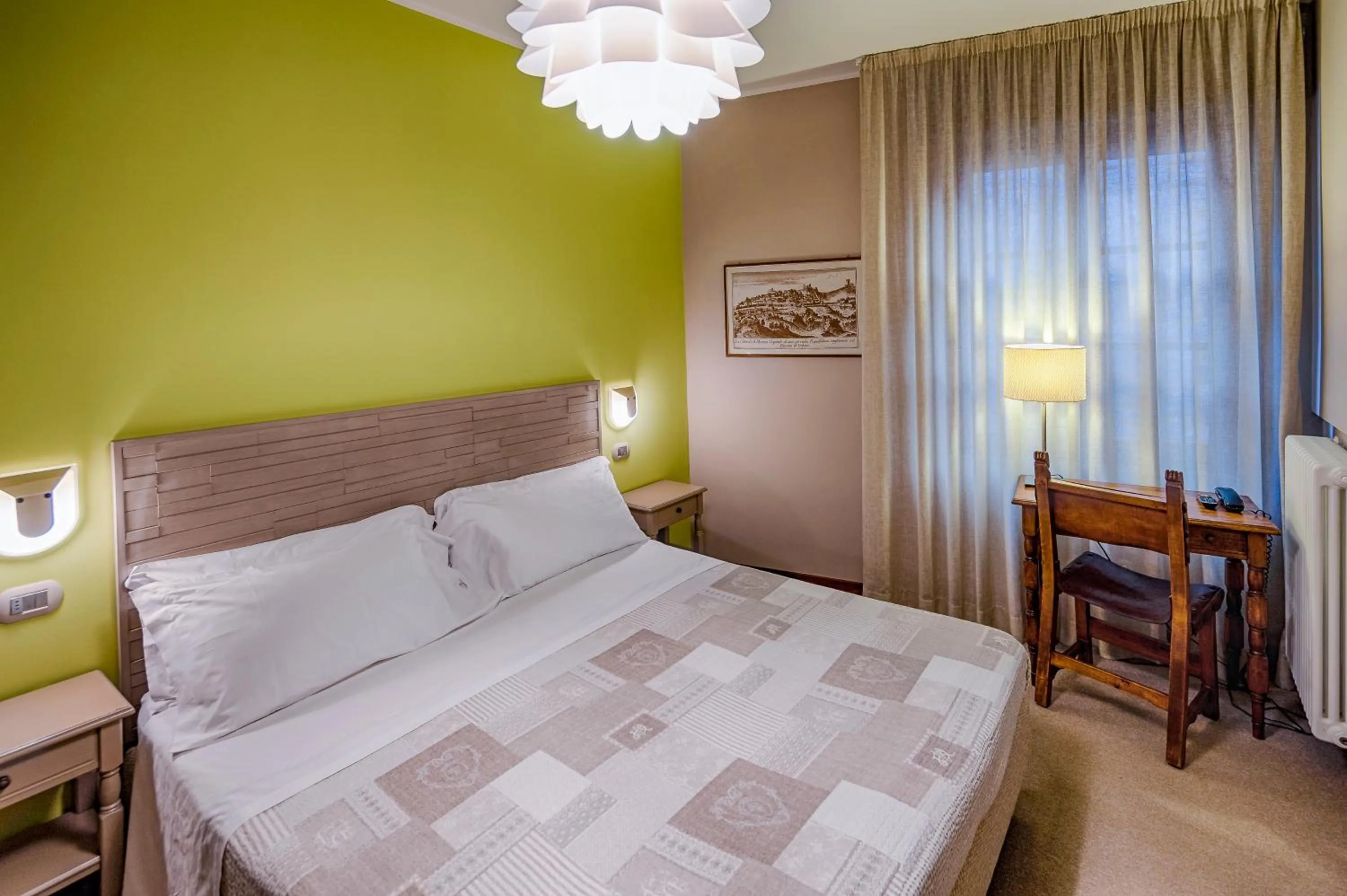 Bed in La Grotta Hotel