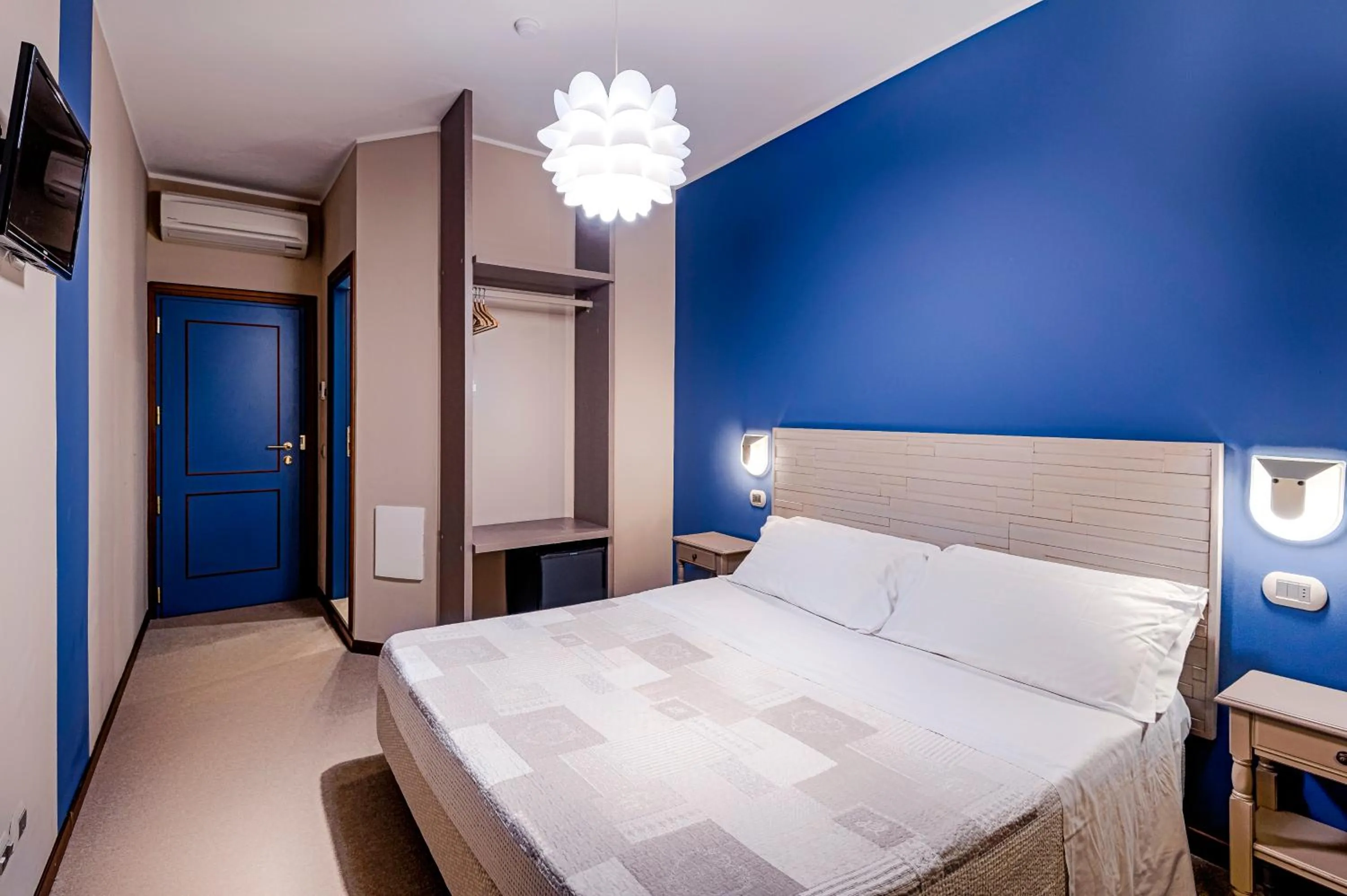 Bed in La Grotta Hotel