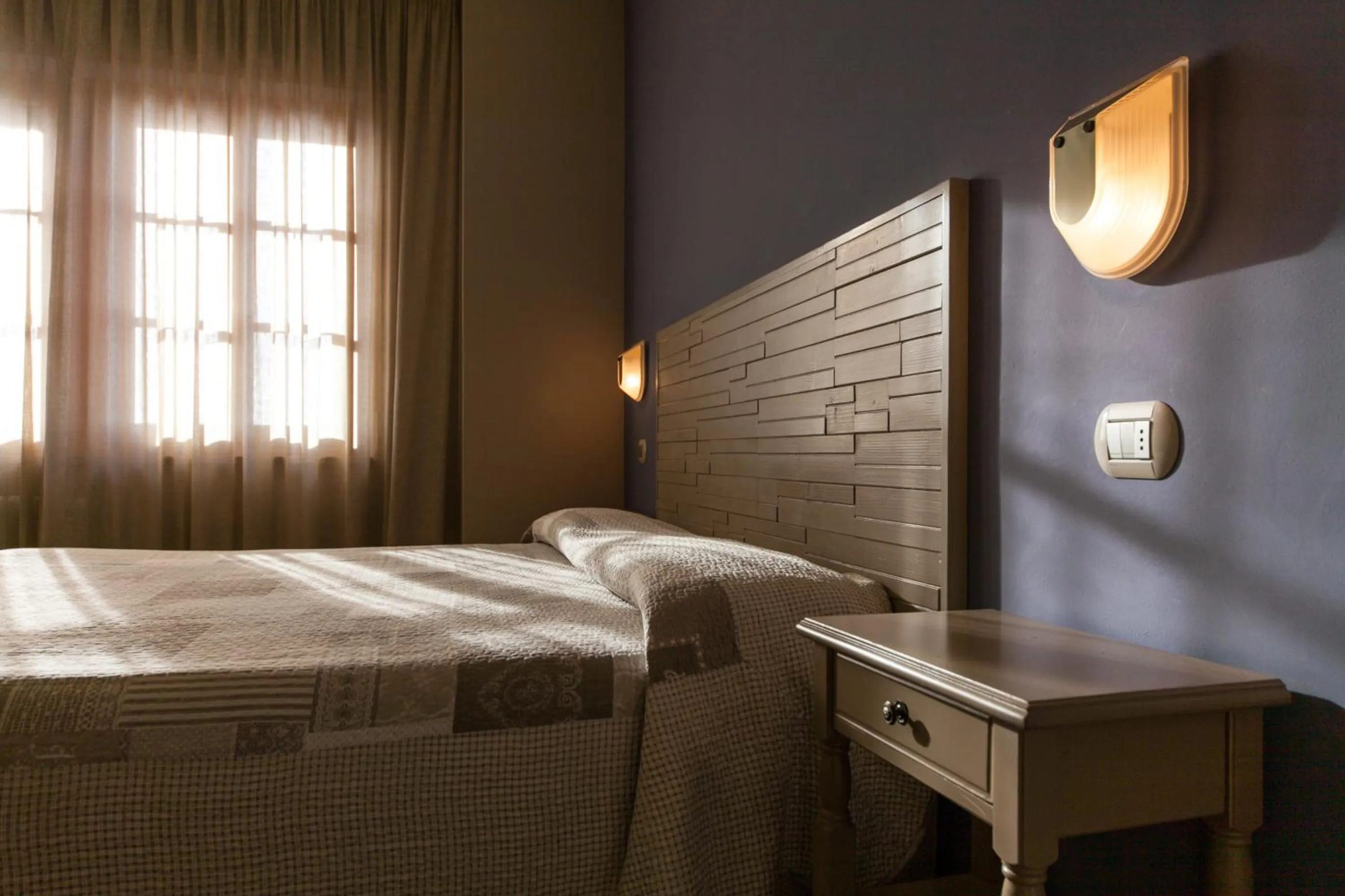 Bed in La Grotta Hotel