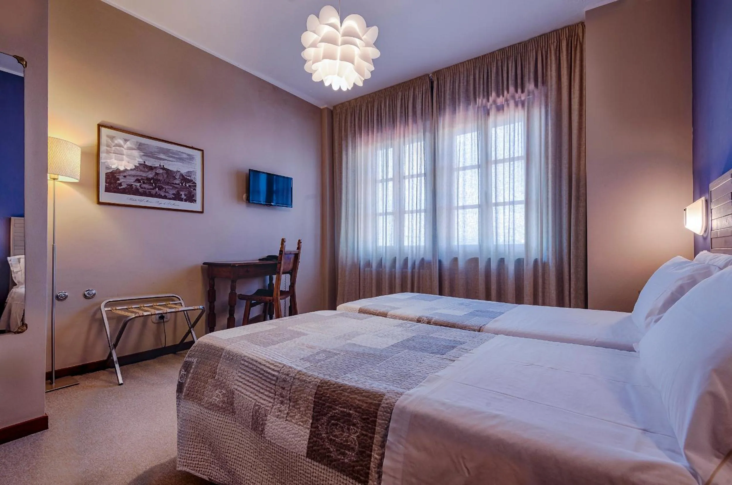 Bed in La Grotta Hotel