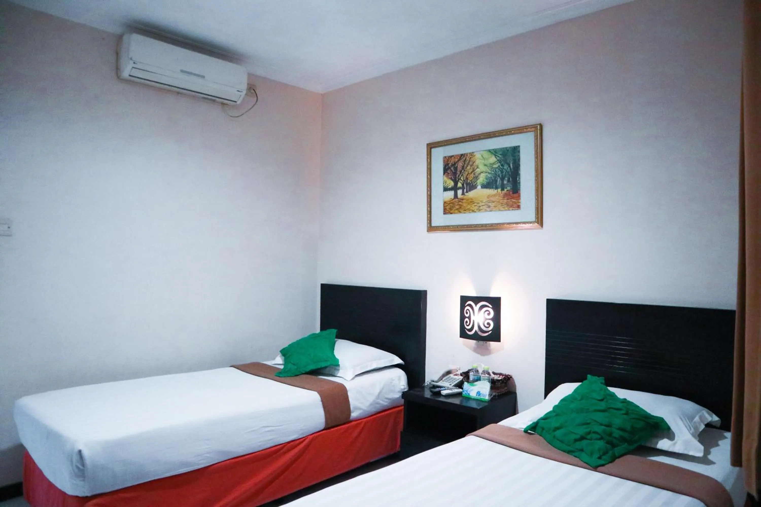 Bed in Helios Hotel Malang