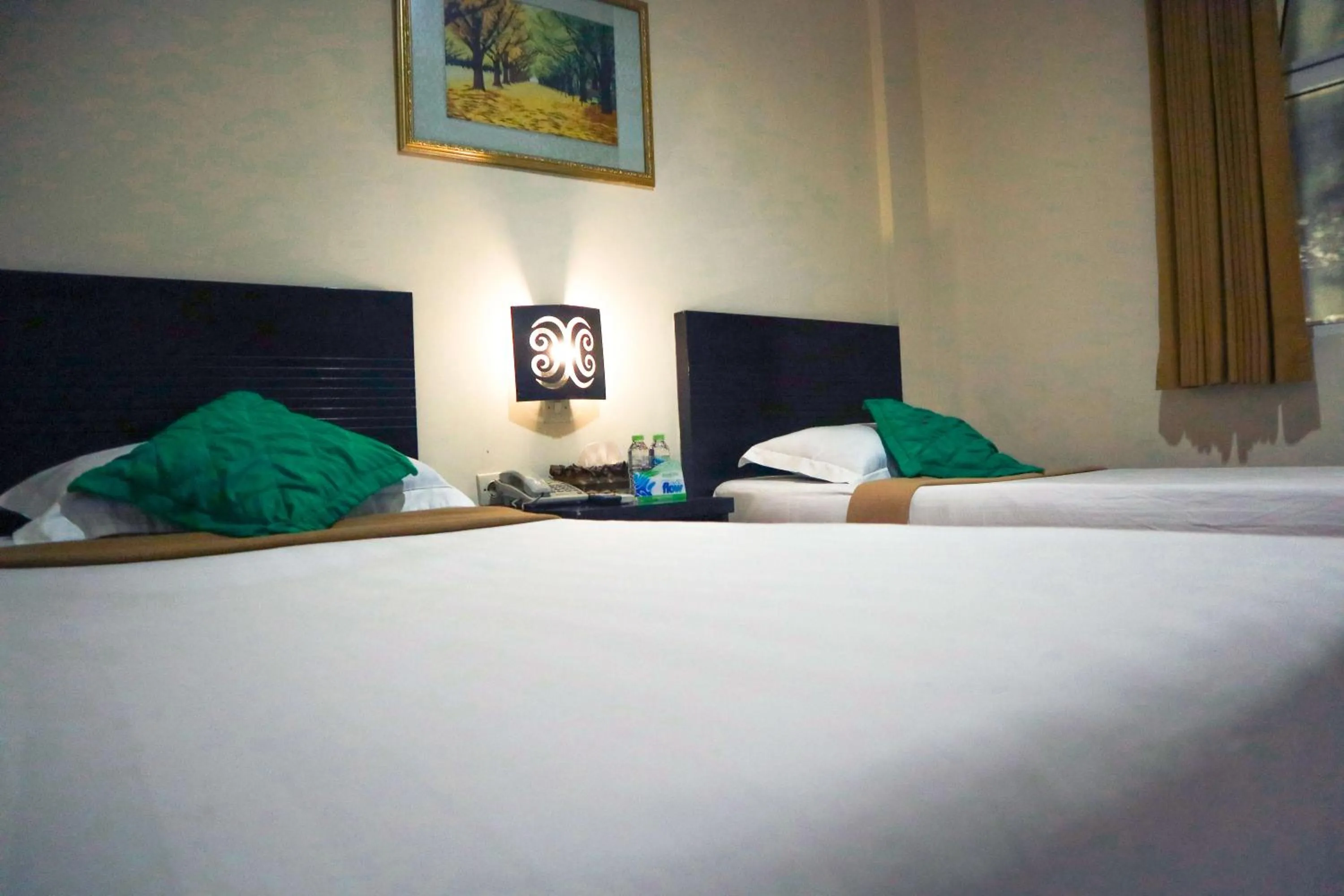 Bed in Helios Hotel Malang