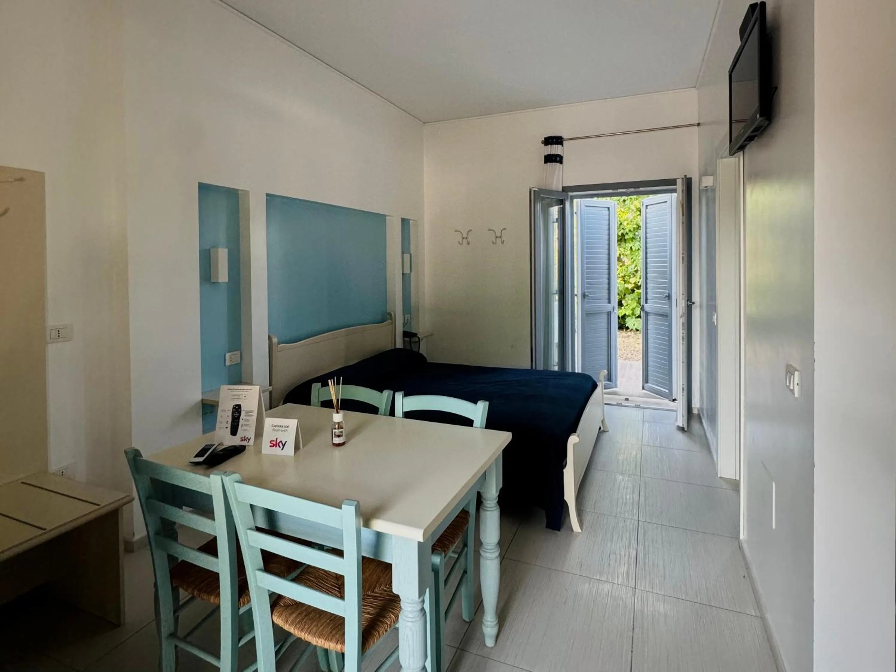 Bed in Baia Sangiorgio Hotel & Beach Club