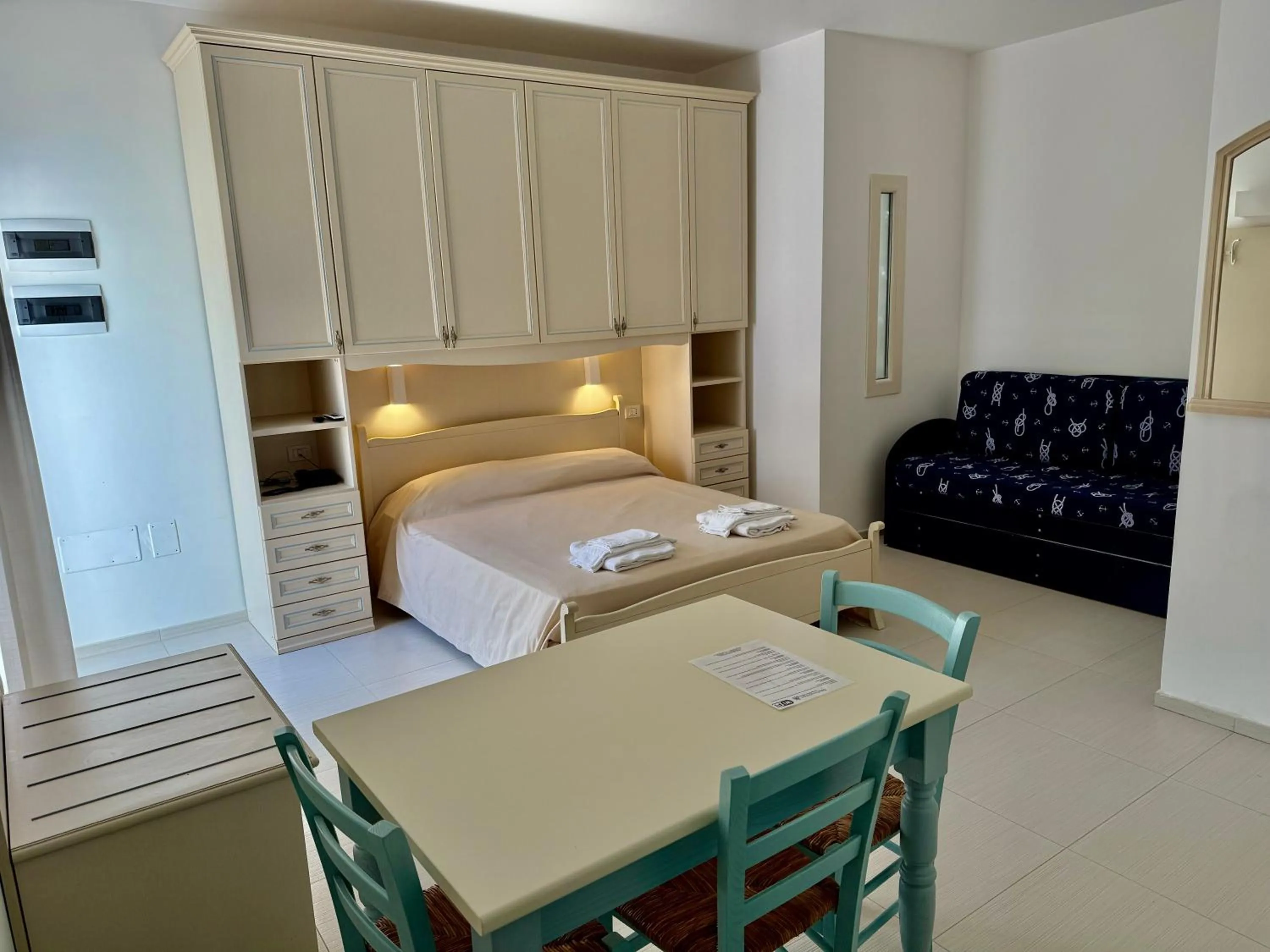 Bed in Baia Sangiorgio Hotel & Beach Club