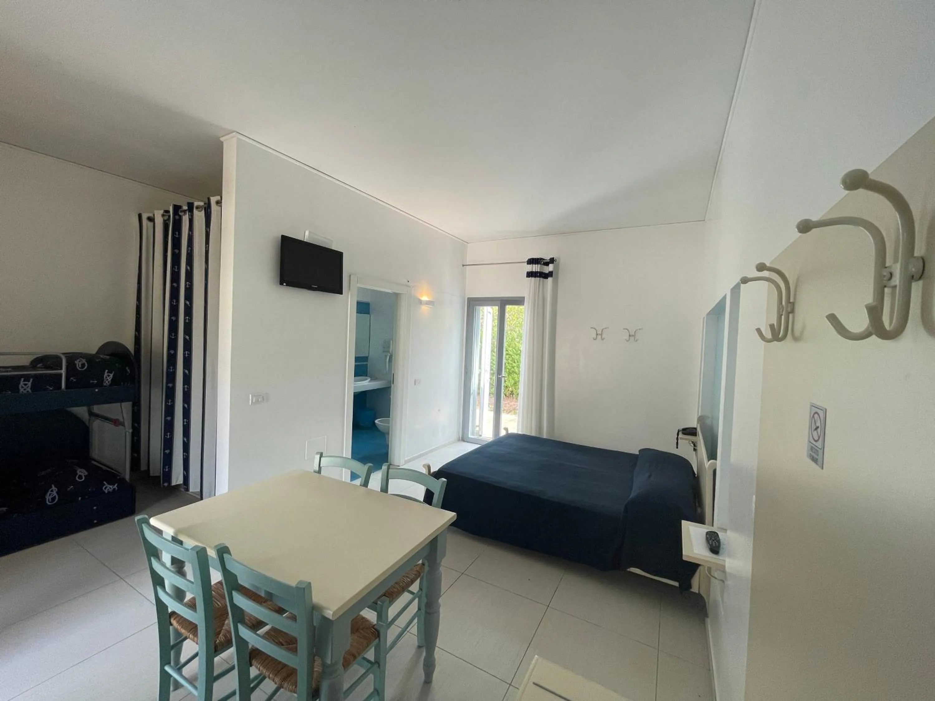 Bed in Baia Sangiorgio Hotel & Beach Club