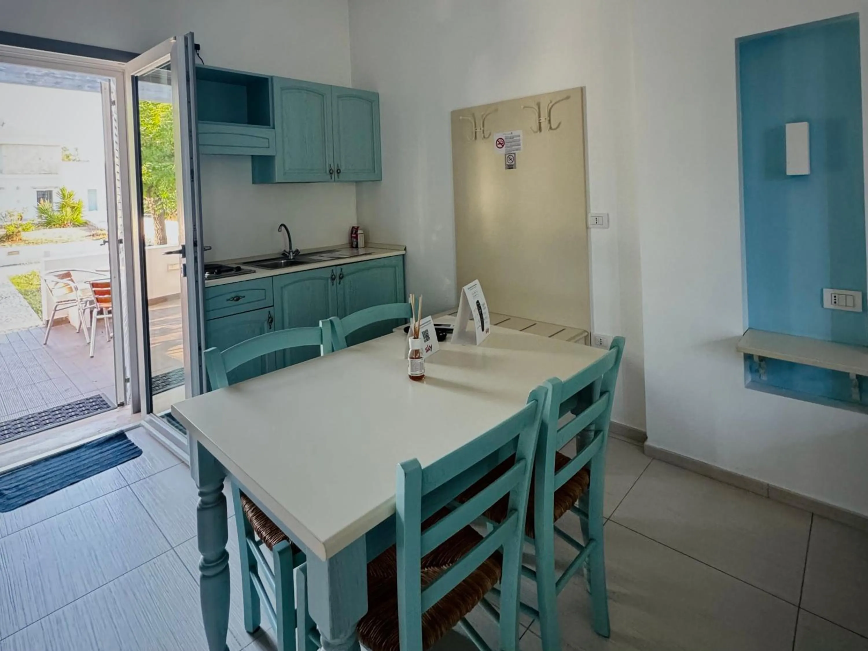 Kitchen or kitchenette in Baia Sangiorgio Hotel & Beach Club