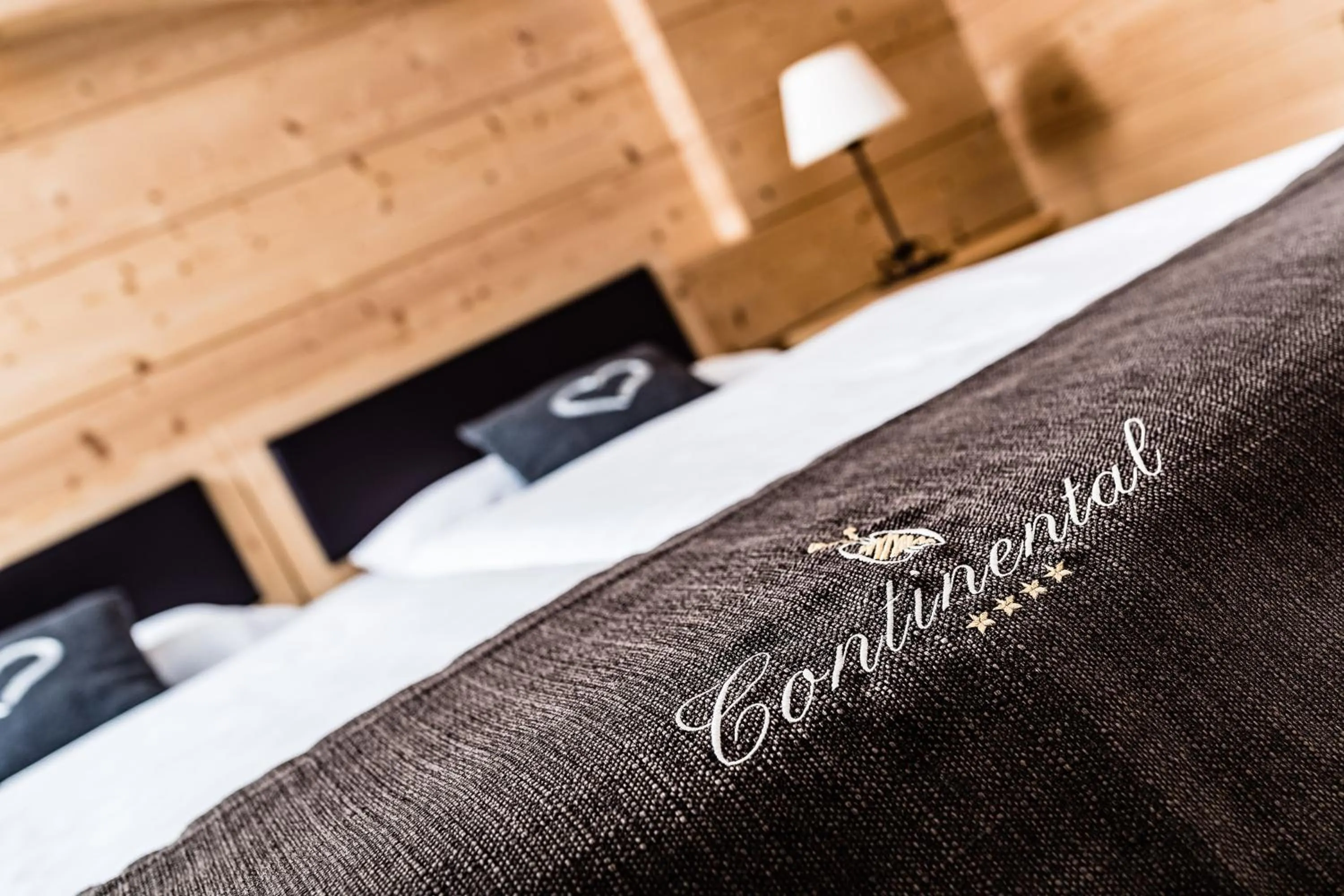 Bed in Hotel Continental Dolomites
