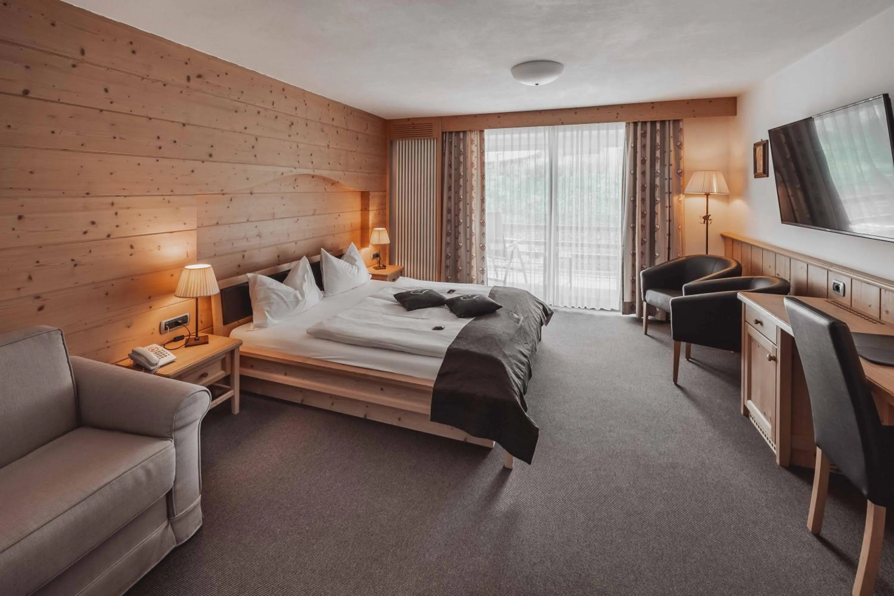 Bedroom, Bed in Hotel Continental Dolomites