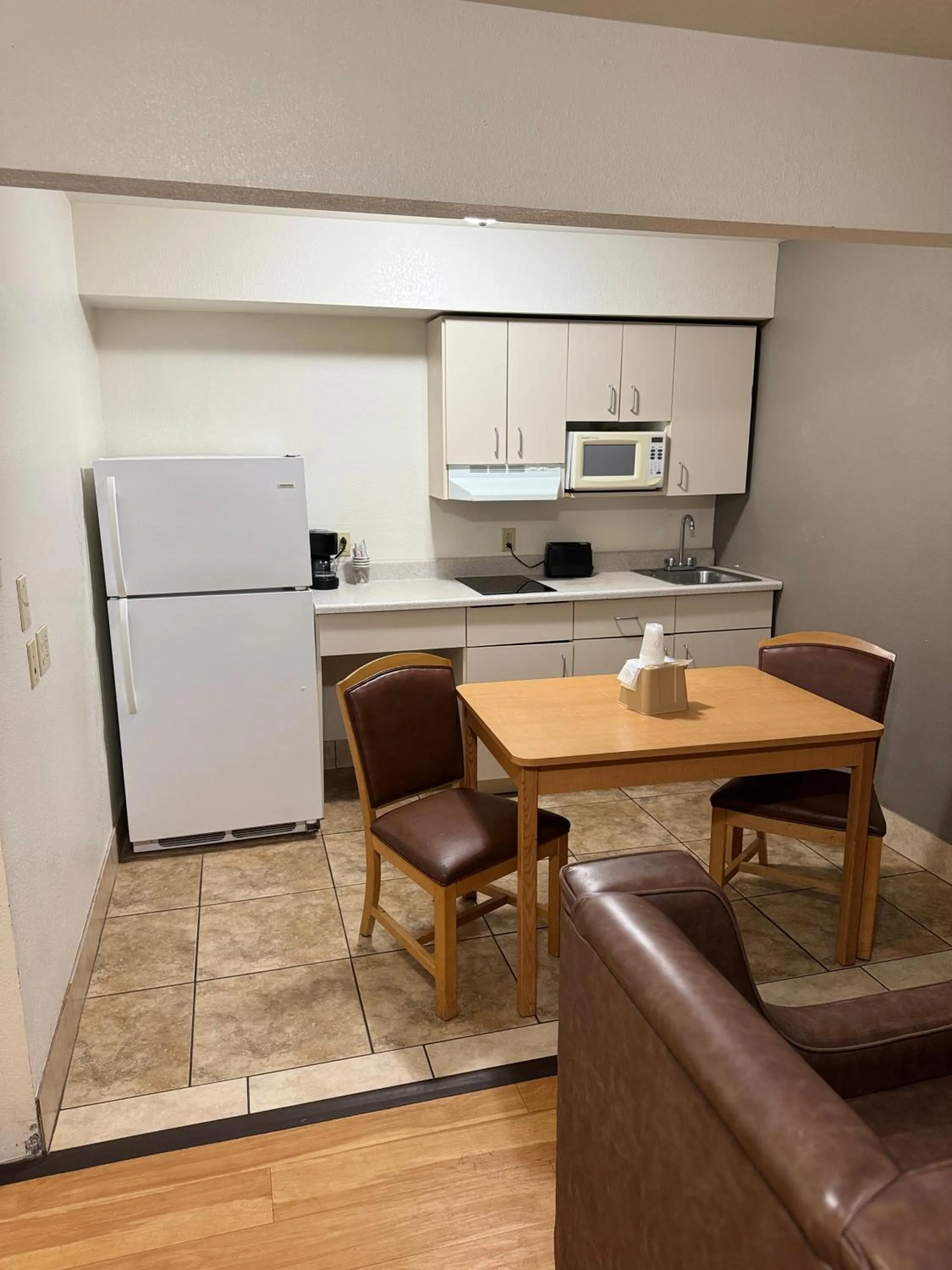 Kitchen or kitchenette in Blue Bonnet Suites -Lubbock, TX - Medical Center