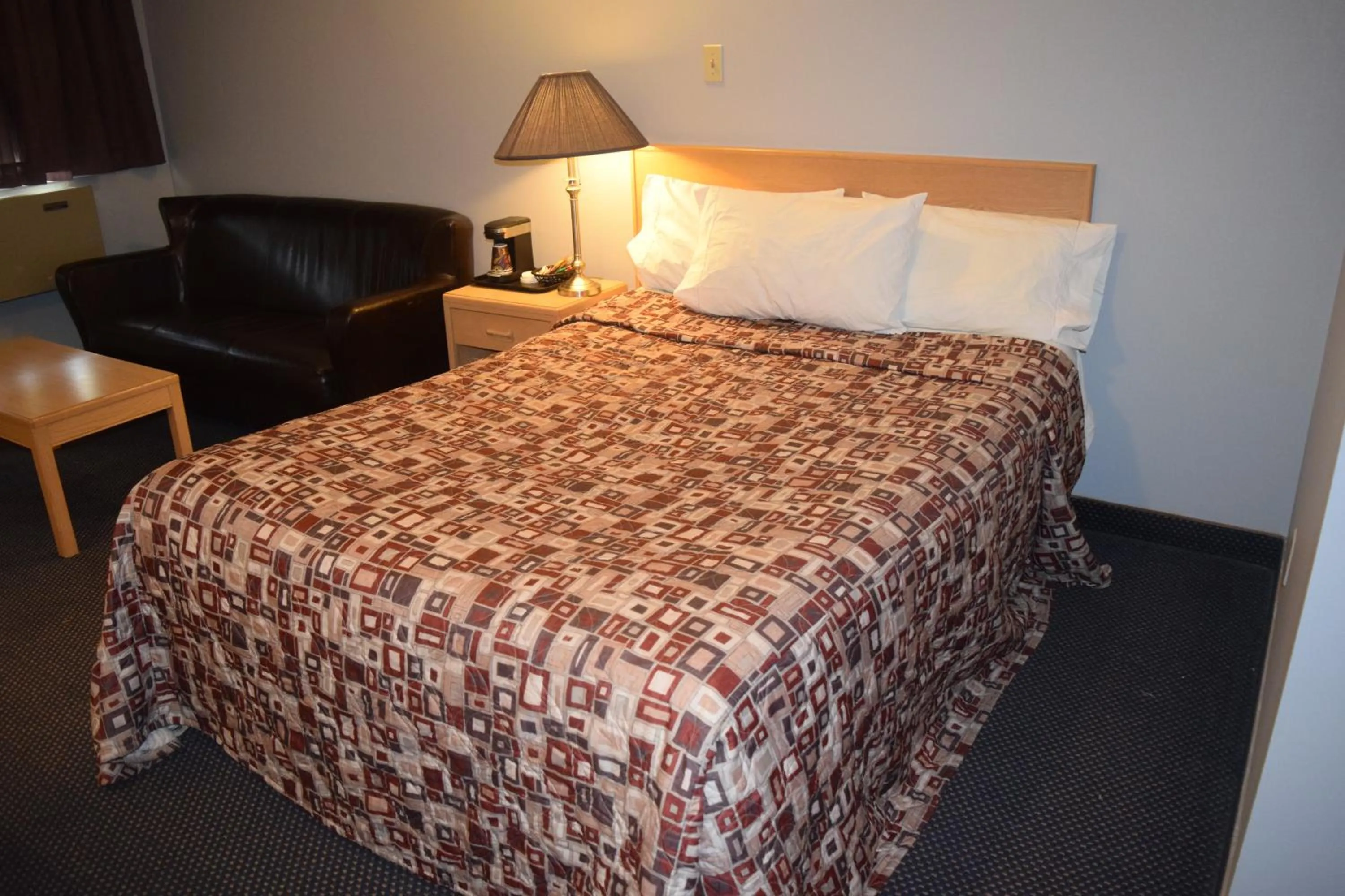 Bed in Venture Inn Hotel