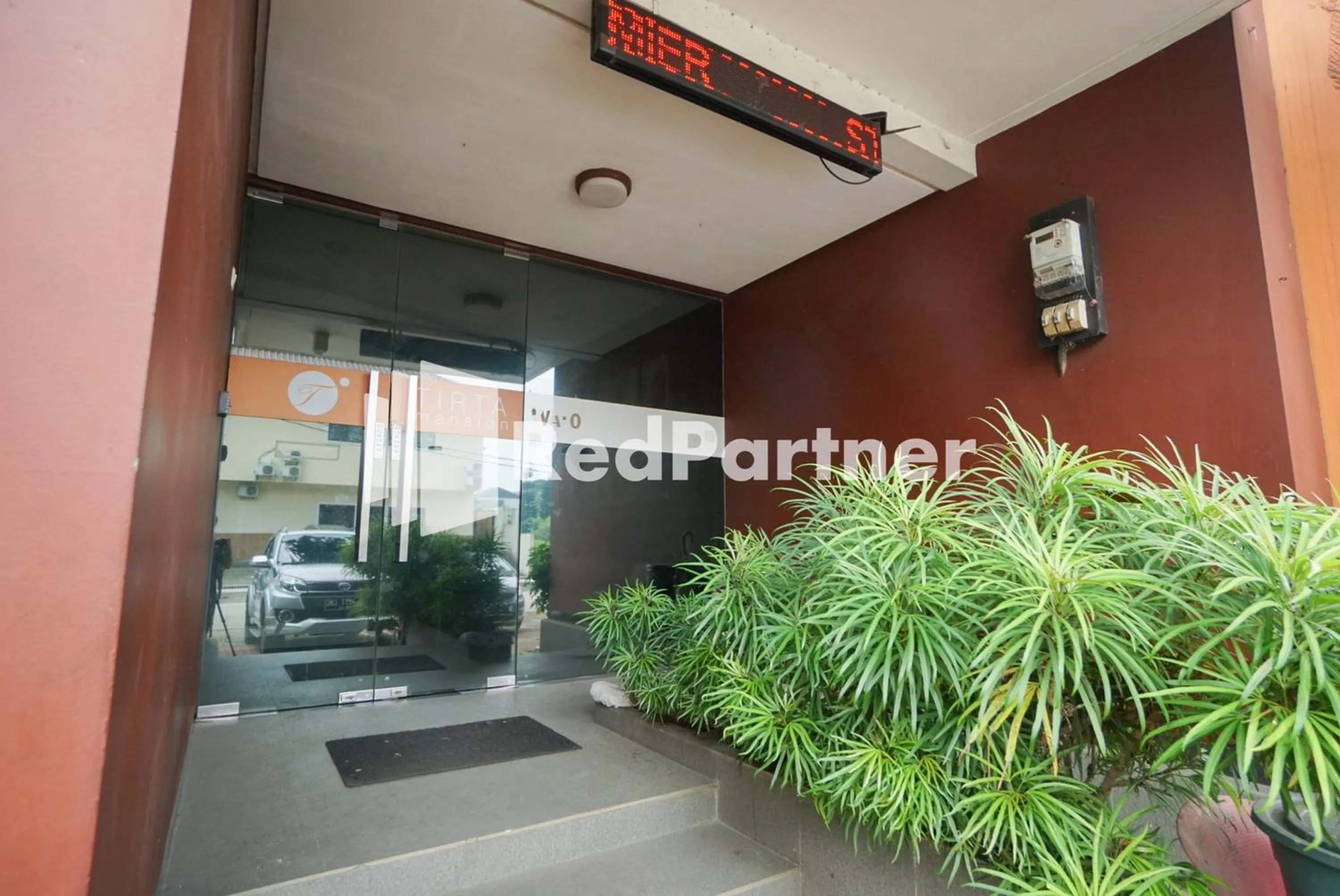 Facade/entrance in Tirta Mansion Lippo Karawaci Mitra RedDoorz
