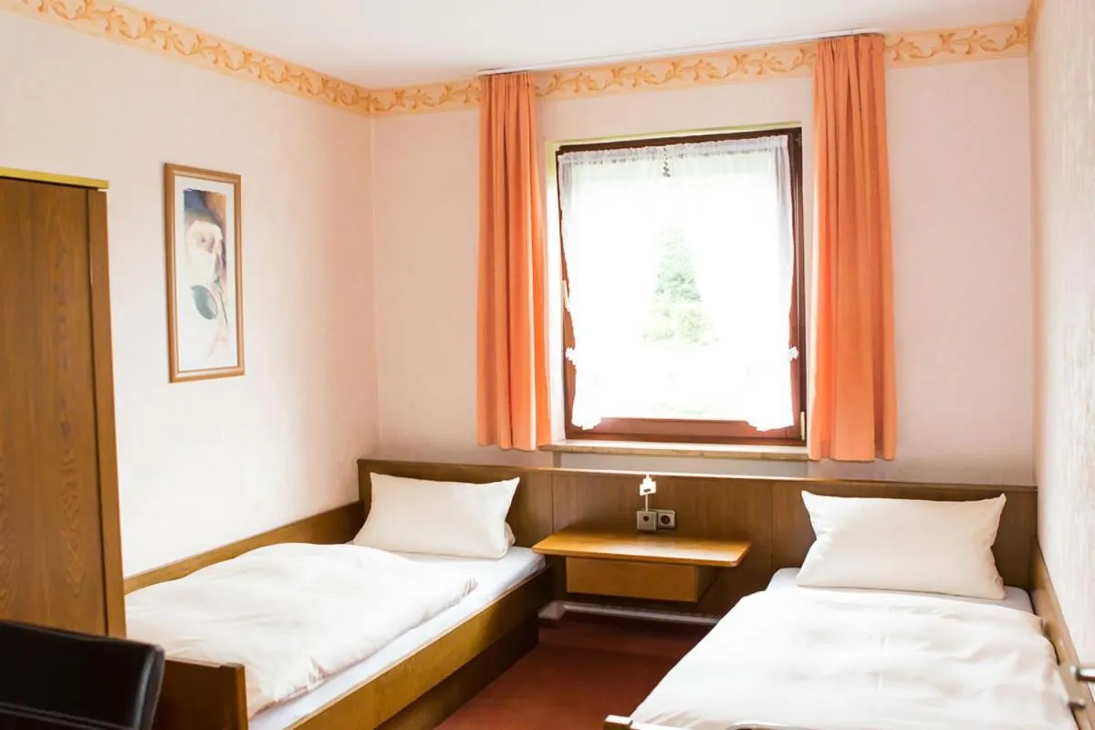 Photo of the whole room, Bed in Gästehaus Loehnert GmbH