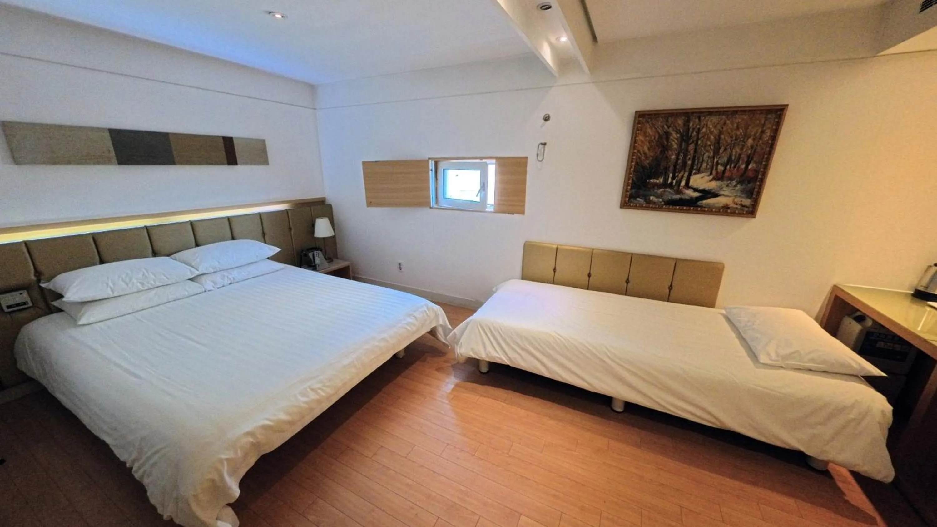 Bed in Friendly DH Naissance Hotel by Mindrum Group