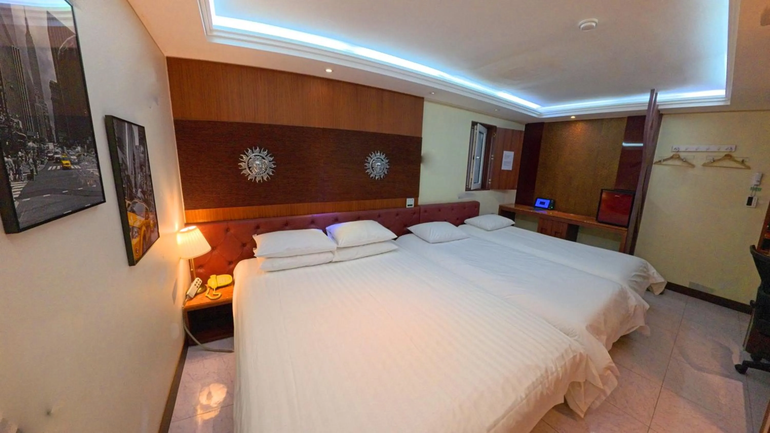 Bed in Friendly DH Naissance Hotel by Mindrum Group