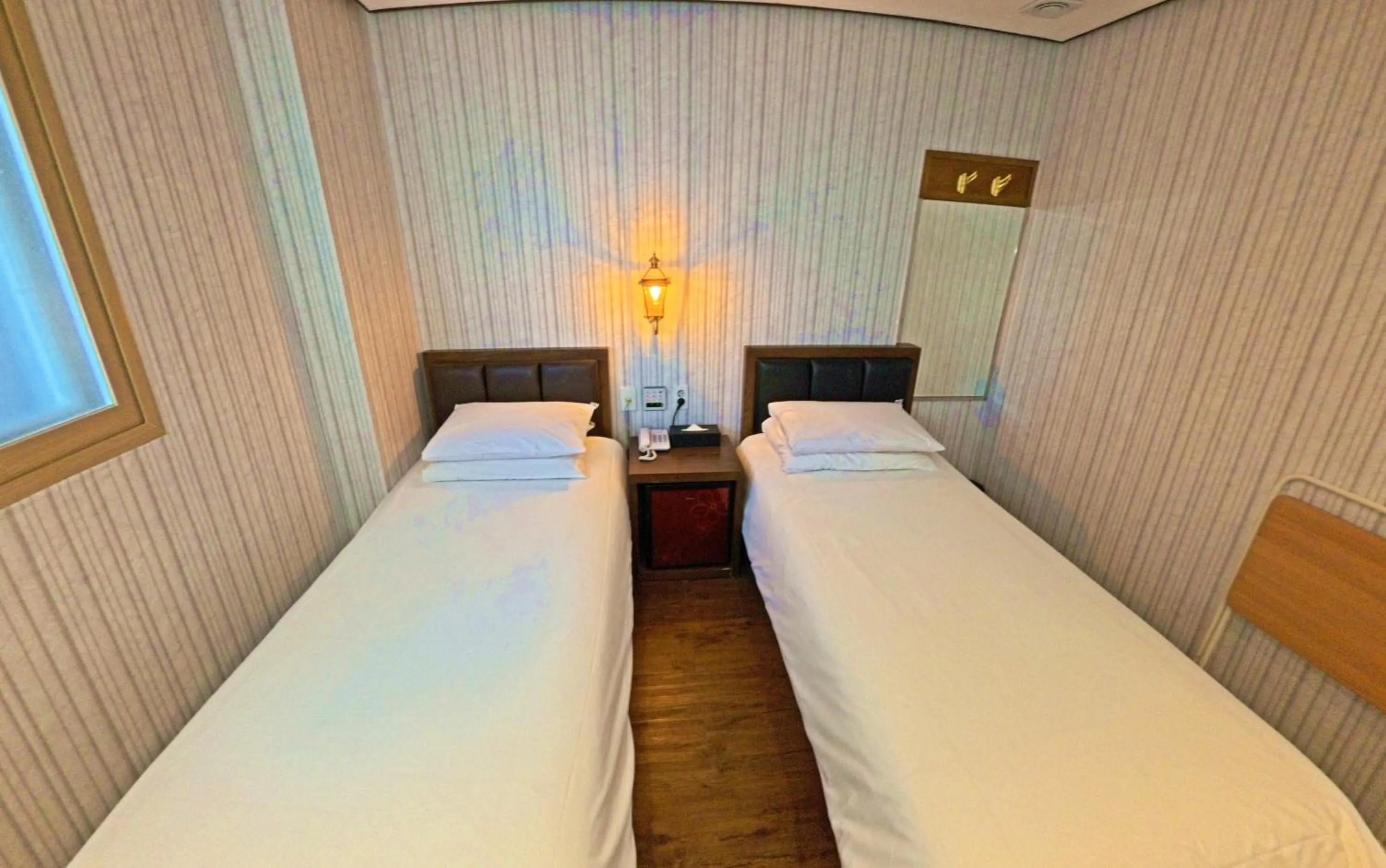 Bed in Friendly DH Naissance Hotel by Mindrum Group