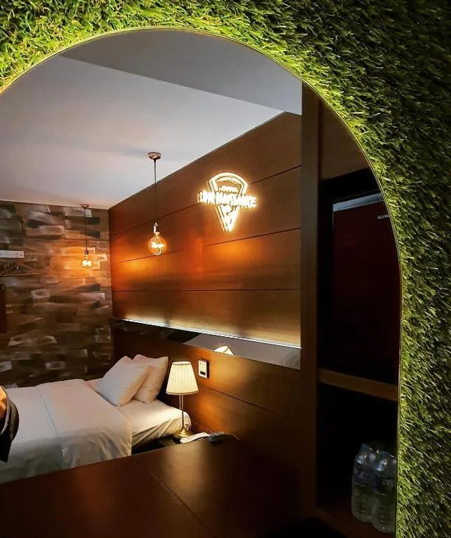 Bed in Friendly DH Naissance Hotel by Mindrum Group