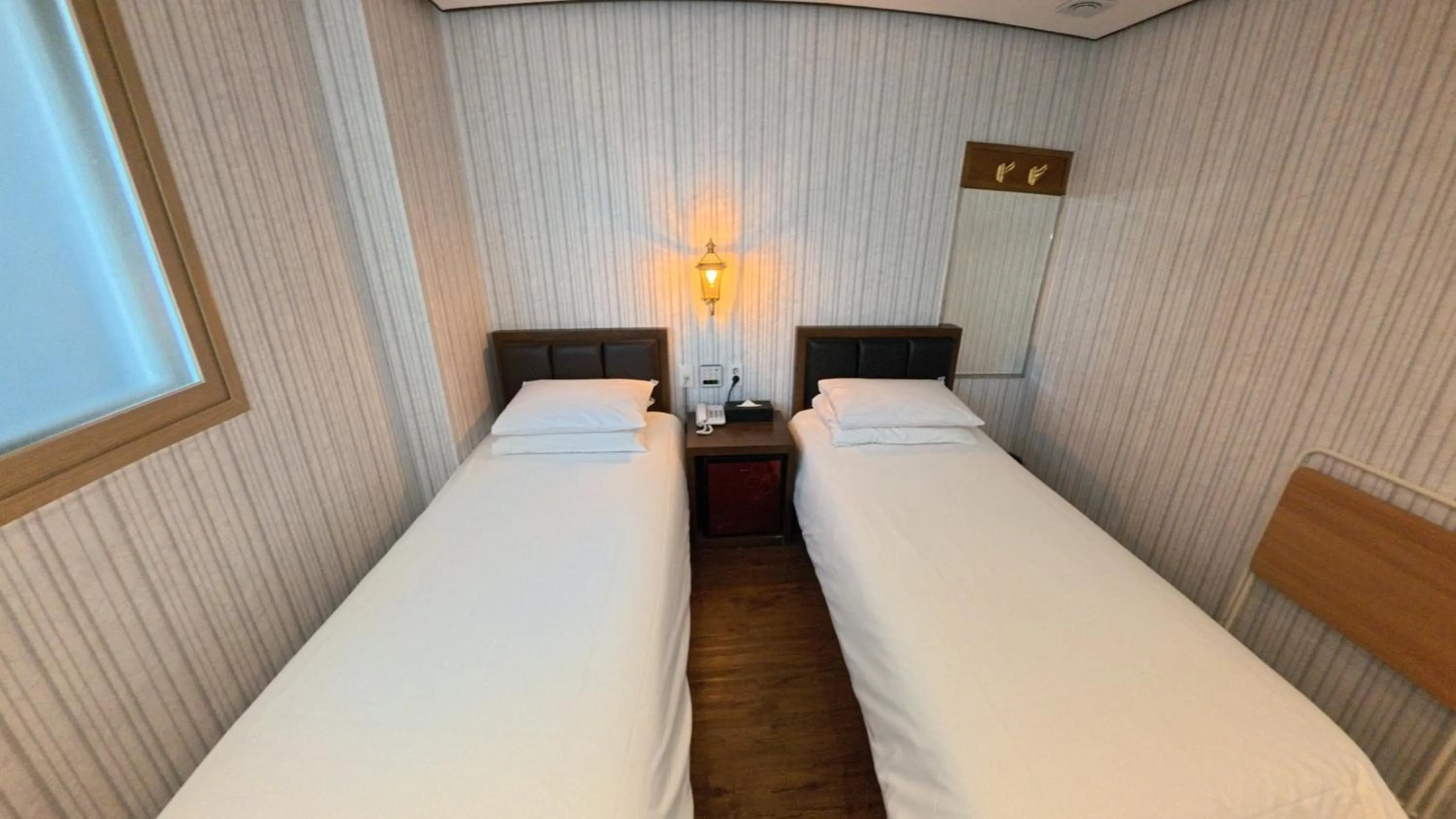 Bed in Friendly DH Naissance Hotel by Mindrum Group